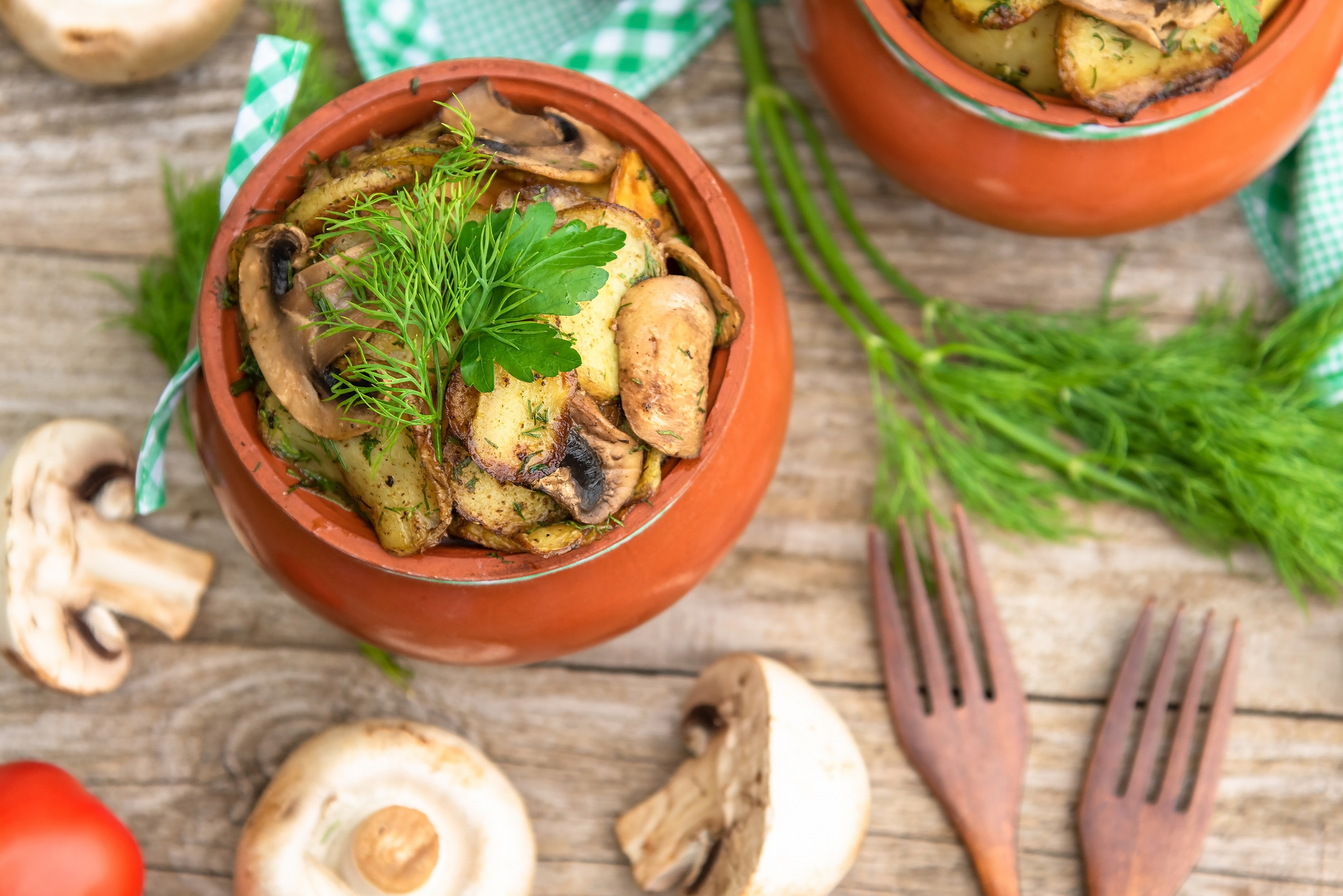 Overhead flat-lay of all ingredients for Succulent Greek Stifado with Mushrooms and Cinnamon laid out on a kitchen surface.