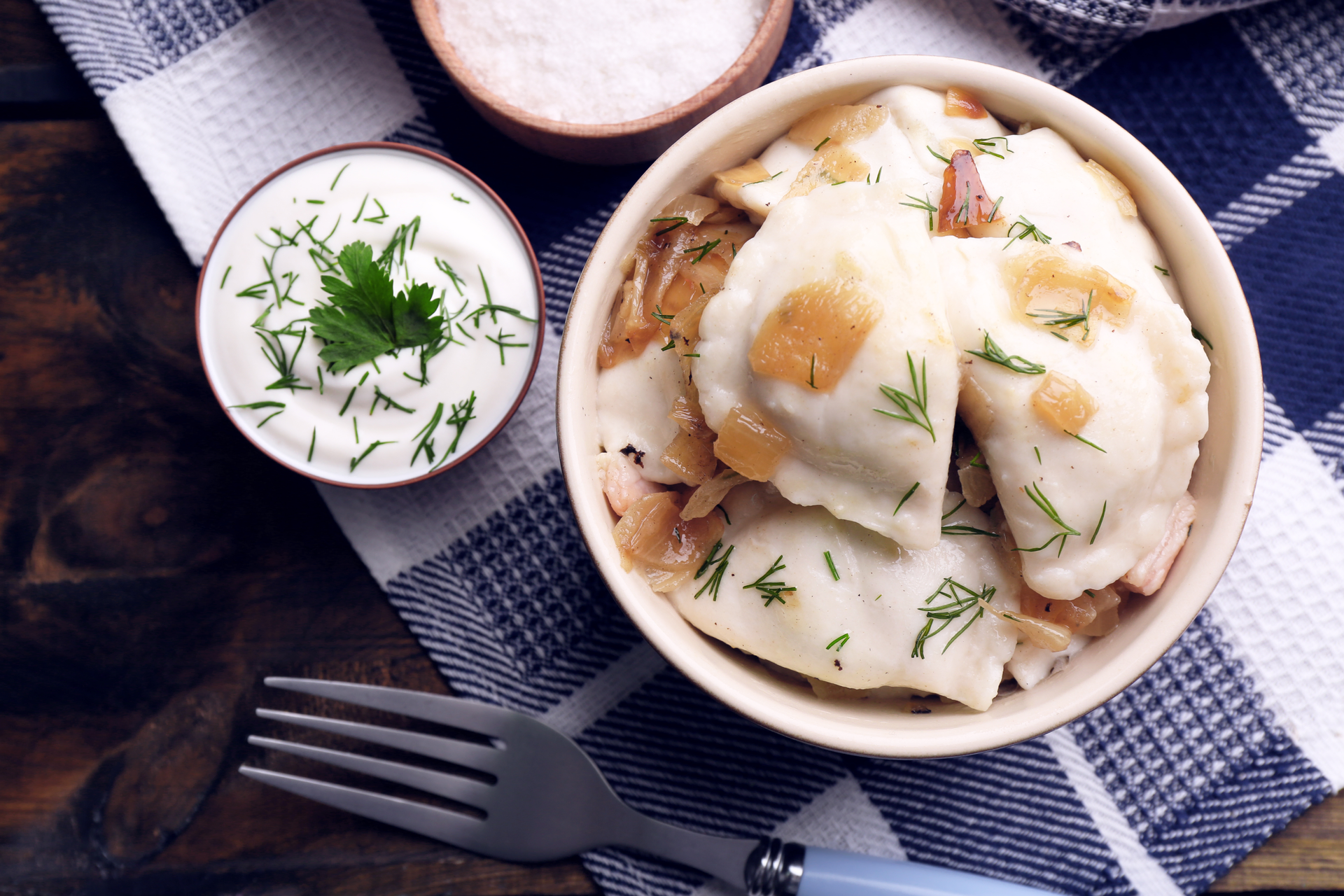 Overhead flat-lay of all ingredients for Sumptuous Turkish Manti with Garlic Yogurt Sauce laid out on a kitchen surface.
