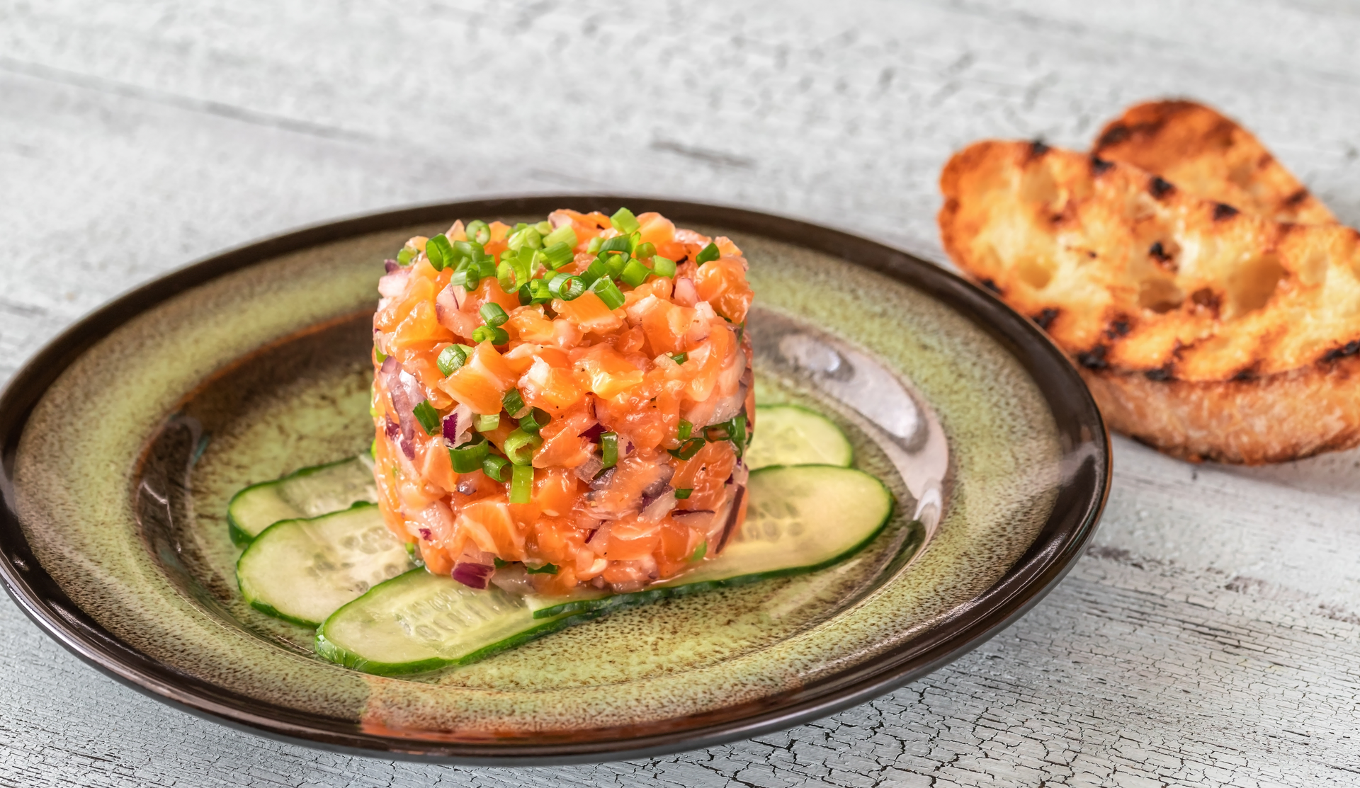Swedish Gravlax Tartare with Dill and Capers — Appetizer served and photographed from above