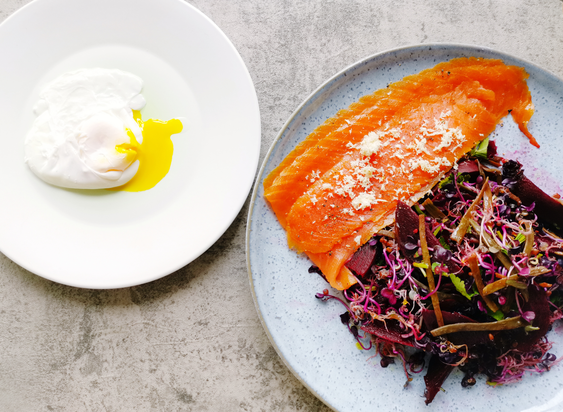 Overhead flat-lay of all ingredients for Swedish Gravlax with Mustard Dill Sauce laid out on a kitchen surface.