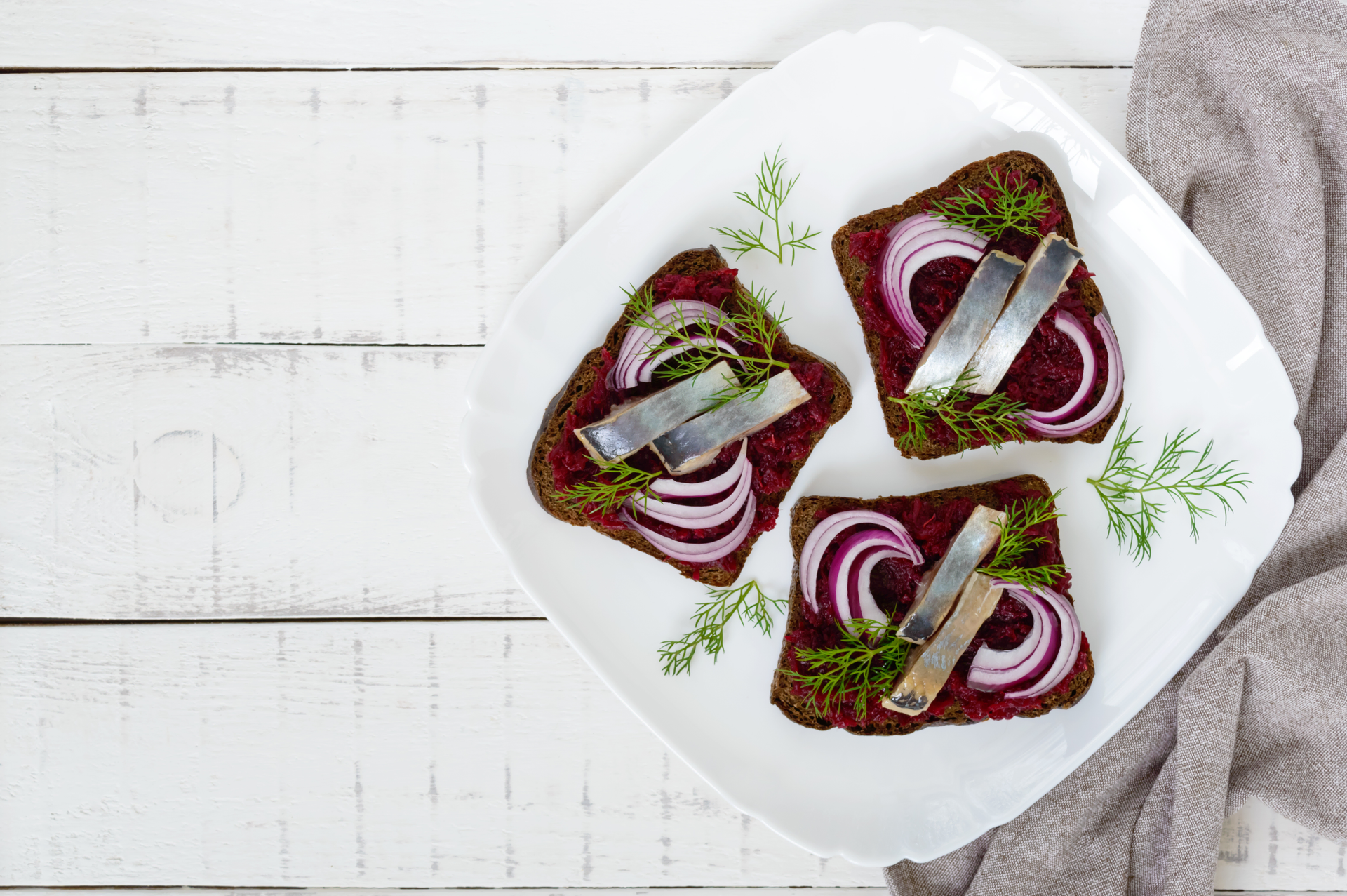 Overhead flat-lay of all ingredients for Swedish Kalops with Horseradish laid out on a kitchen surface.
