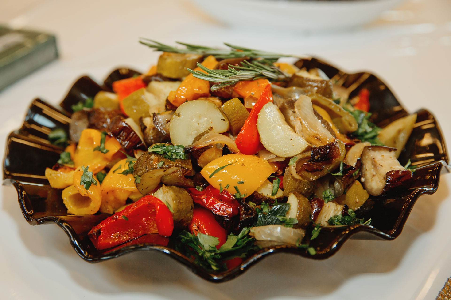 Overhead flat-lay of all ingredients for Sweet and Spicy Egyptian Dukkah-Dusted Roasted Vegetables laid out on a kitchen surface.