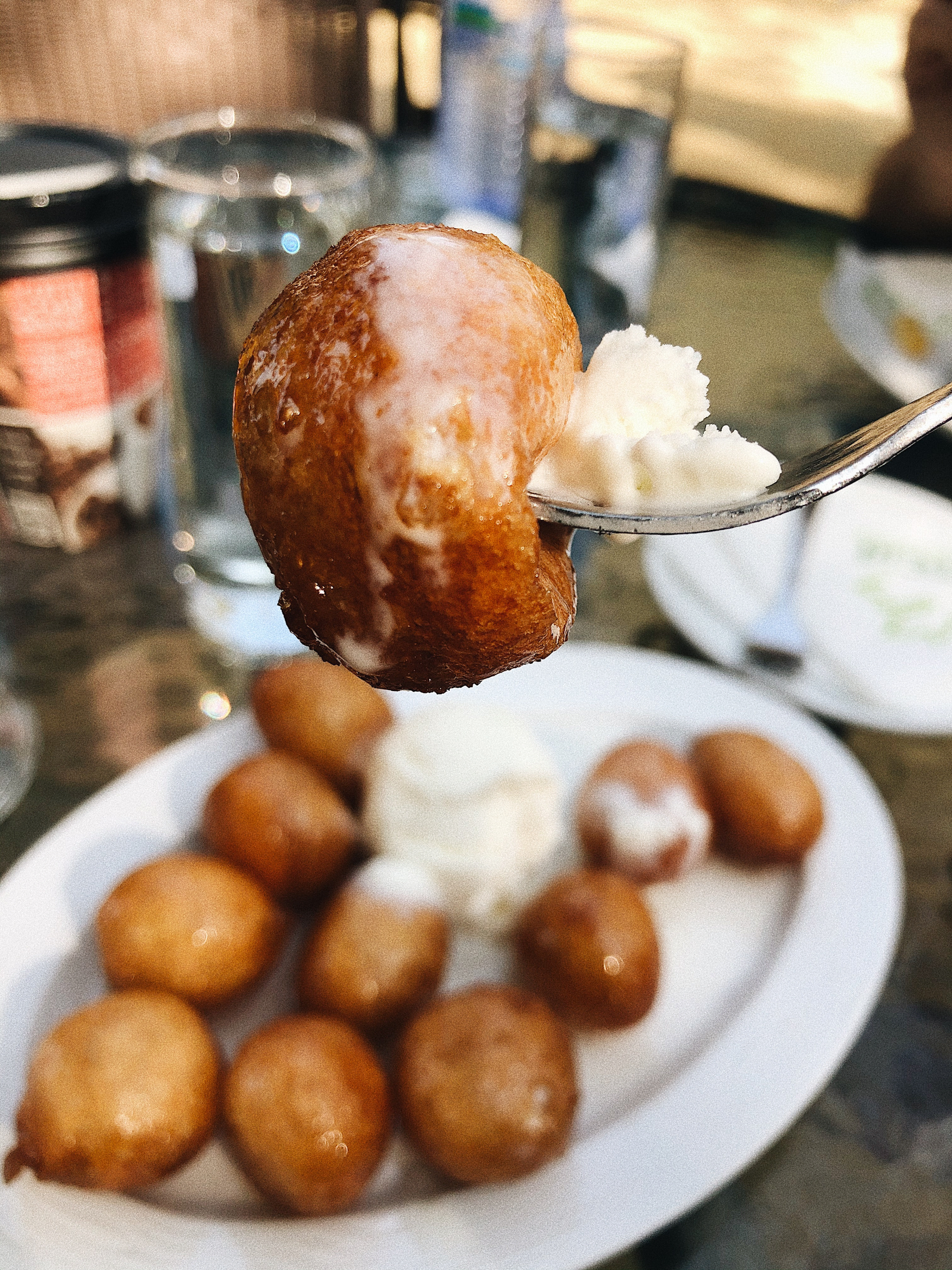 Overhead flat-lay of all ingredients for Sweet Cuban Buñuelos with Anise-Infused Syrup laid out on a kitchen surface.