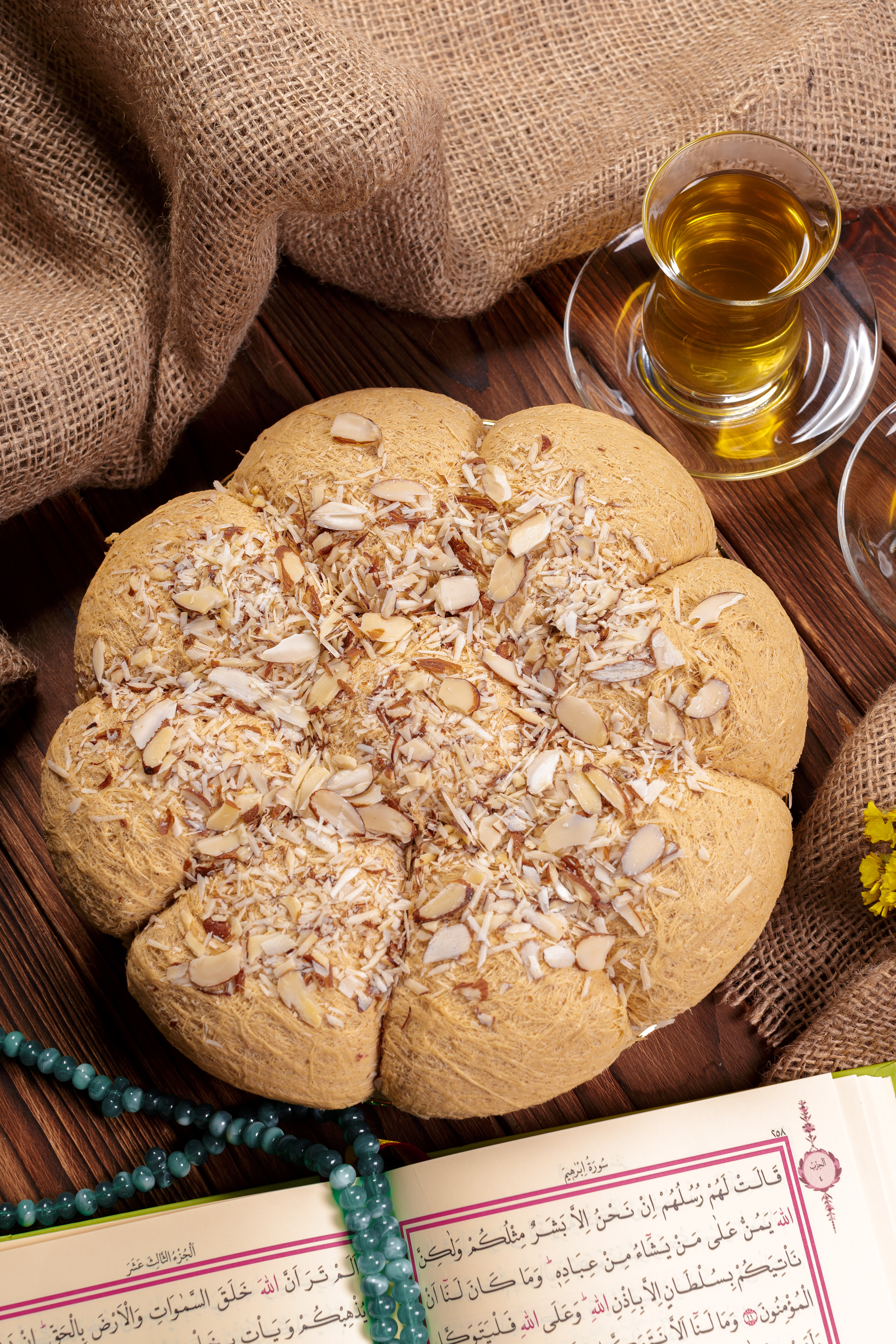 Overhead flat-lay of all ingredients for Sweet Egyptian Basbousa with Almond Soaked Syrup laid out on a kitchen surface.