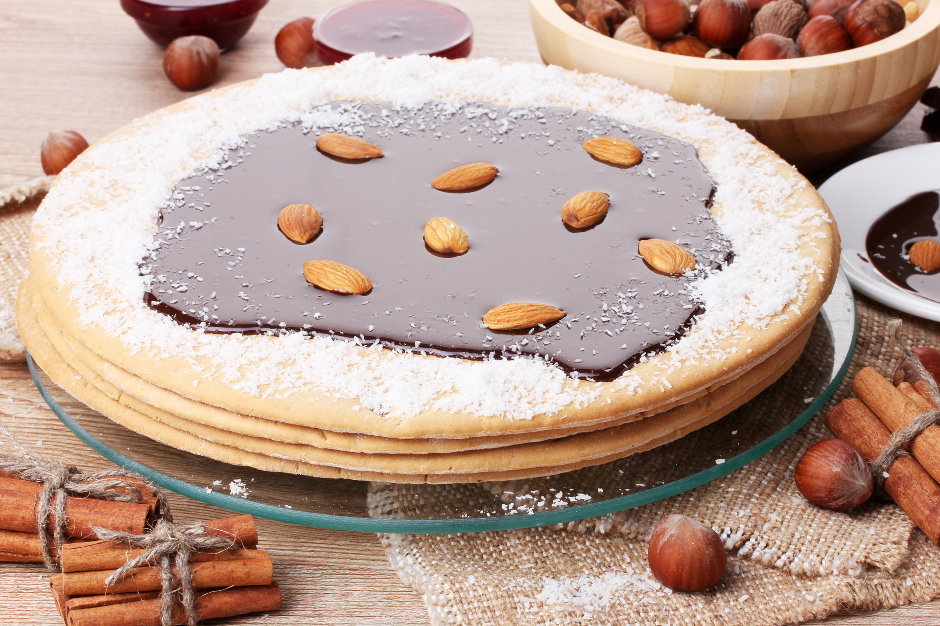 Overhead flat-lay of all ingredients for Sweet Finnish Runeberg Torte with Almond Liqueur Glaze laid out on a kitchen surface.