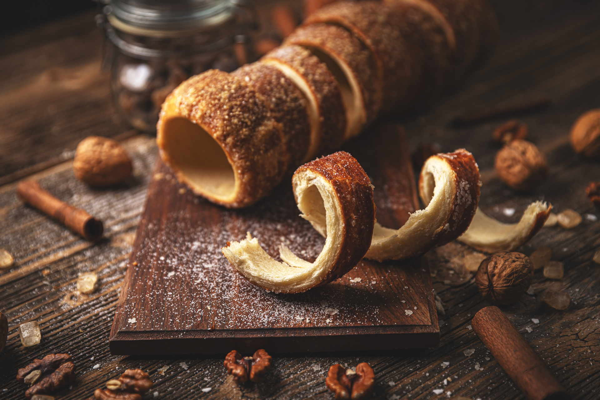 Overhead flat-lay of all ingredients for Sweet Hungarian Kürtőskalács with Cinnamon Sugar Dusting laid out on a kitchen surface.