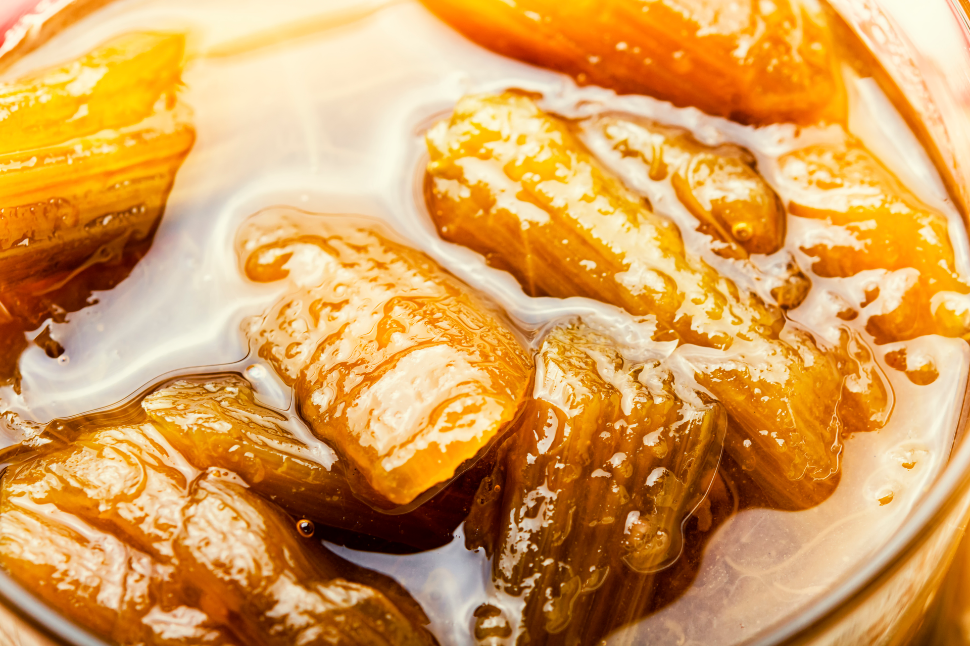 Overhead flat-lay of all ingredients for Sweet Indonesian Pisang Goreng with Caramel Drizzle laid out on a kitchen surface.