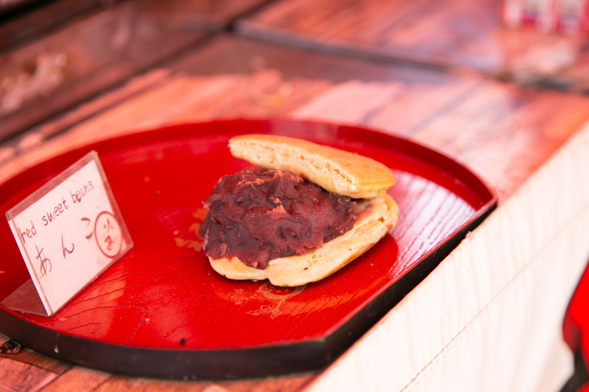 Overhead flat-lay of all ingredients for Sweet Japanese Dorayaki with Red Bean Filling laid out on a kitchen surface.