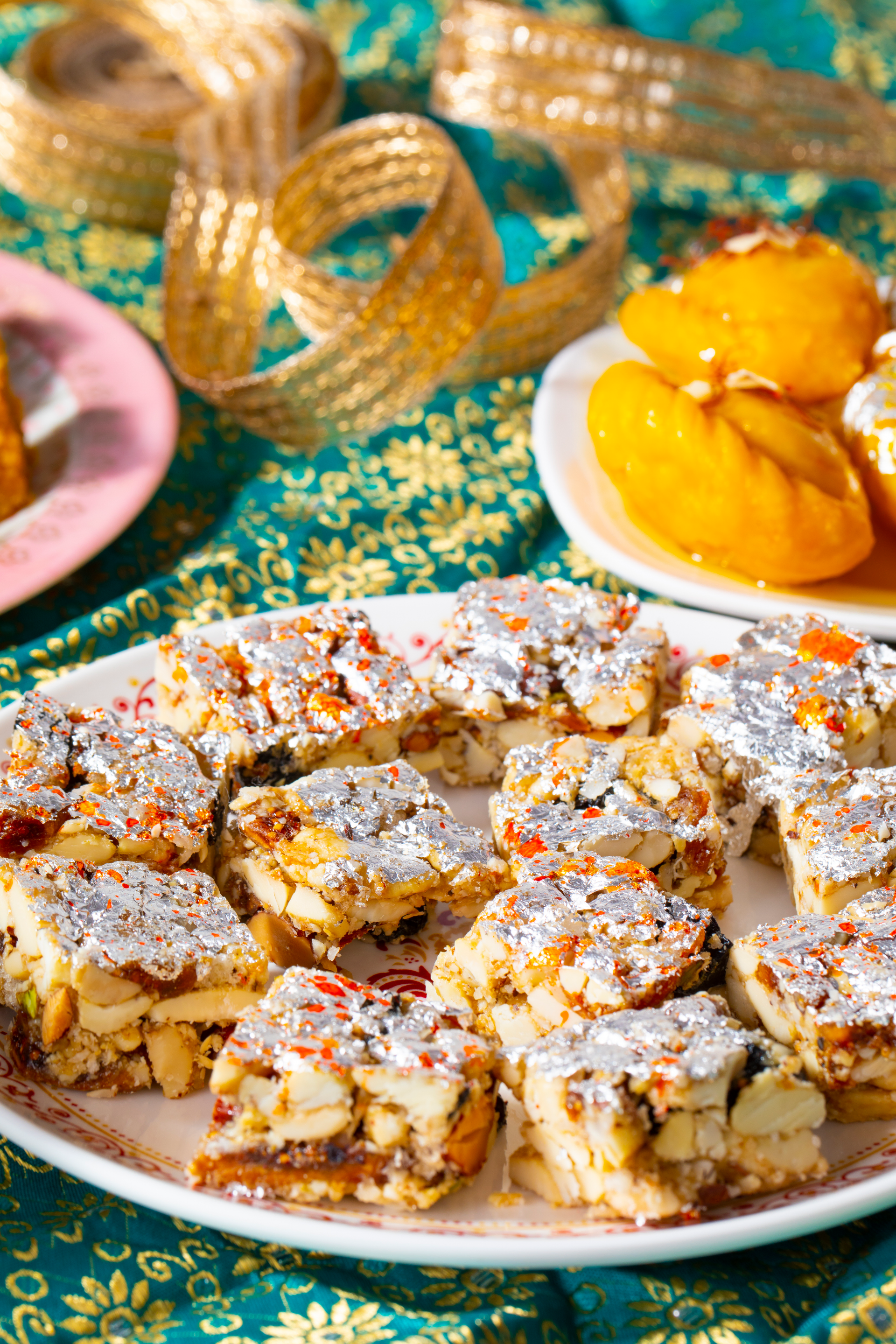 Overhead flat-lay of all ingredients for Sweet Moroccan M’hanncha Dessert with Almond Paste laid out on a kitchen surface.
