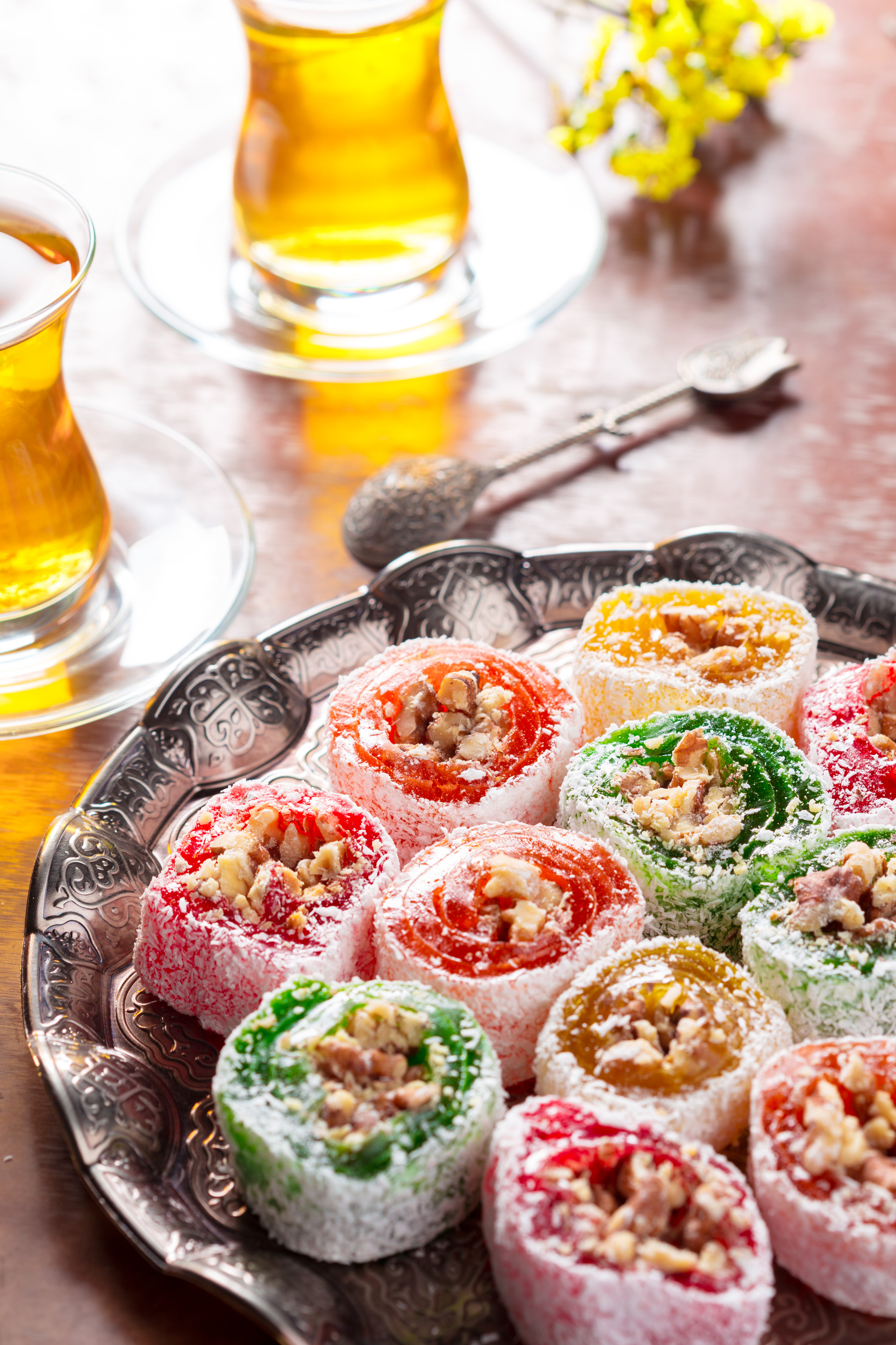 Overhead flat-lay of all ingredients for Sweet Persian Baklava with Pistachio and Rose Water Syrup laid out on a kitchen surface.
