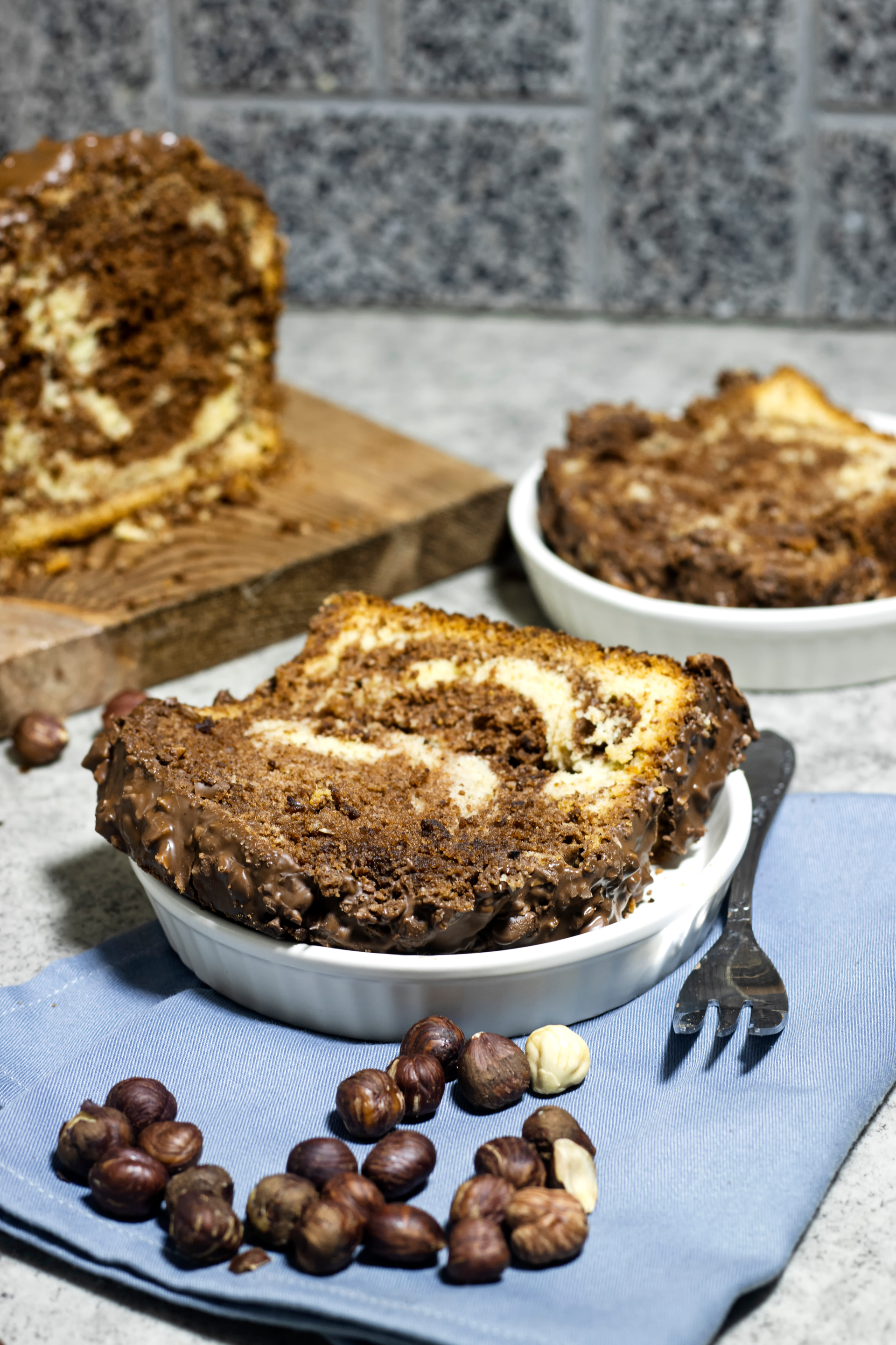 Overhead flat-lay of all ingredients for Sweet Romanian Cozonac with Walnuts and Cocoa laid out on a kitchen surface.