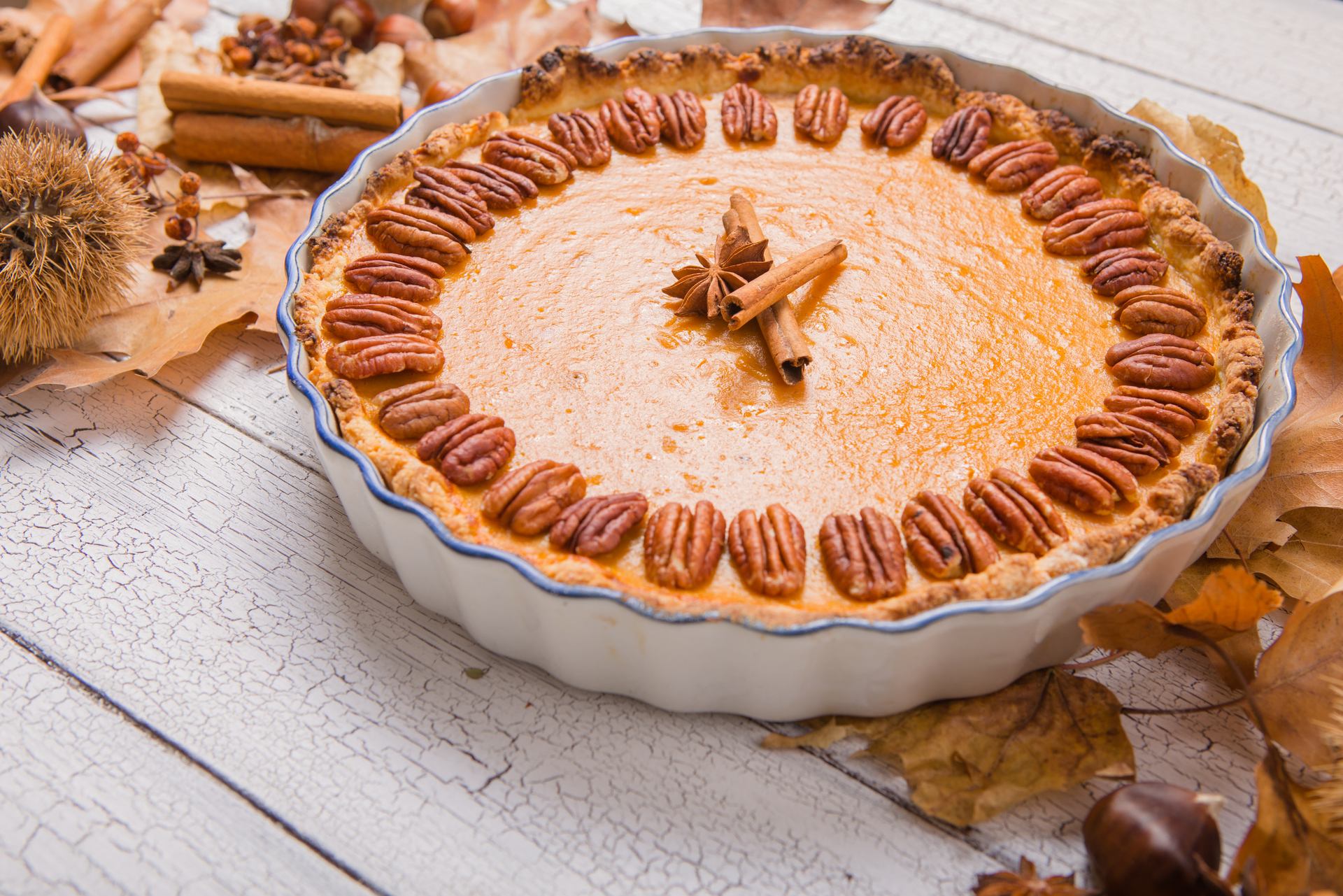 Overhead flat-lay of all ingredients for Sweet South African Milk Tart with Cinnamon and Nutmeg laid out on a kitchen surface.