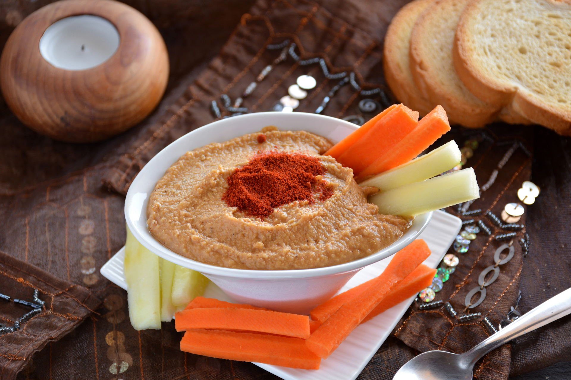 Overhead flat-lay of all ingredients for Syrian Muhammara with Roasted Red Peppers and Walnuts laid out on a kitchen surface.