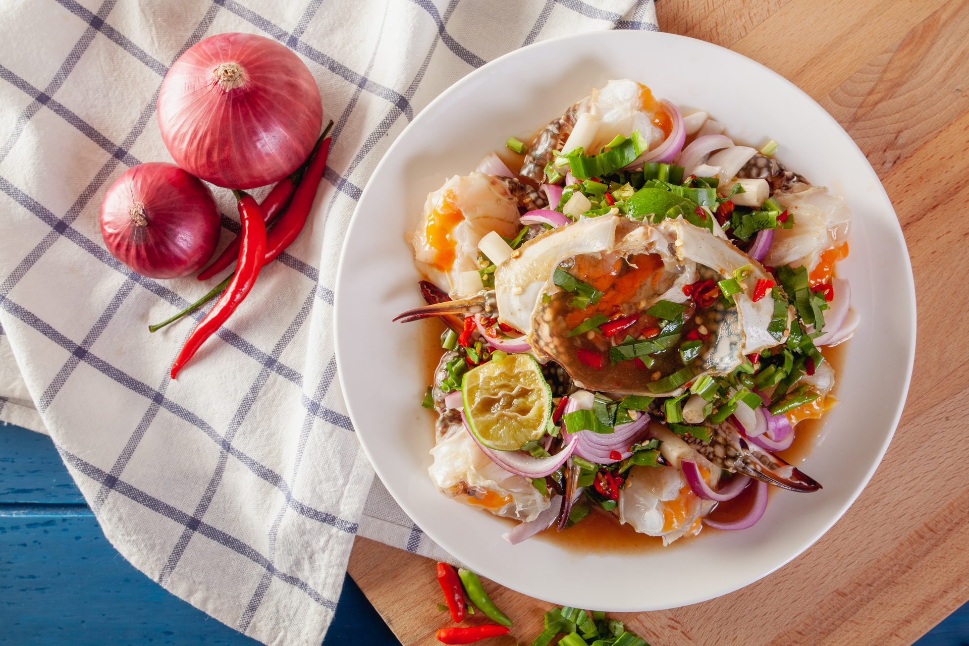 Overhead flat-lay of all ingredients for Tangy Filipino Ensaladang Talong with Salted Egg and Tomato laid out on a kitchen surface.