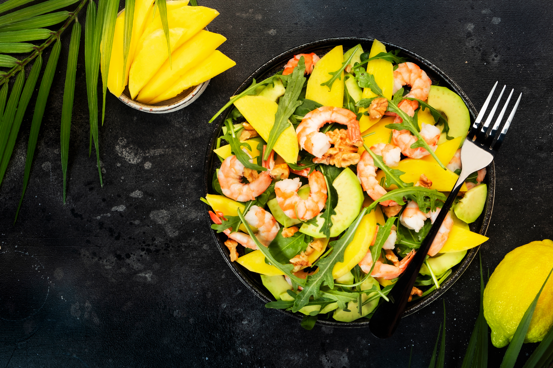 Overhead flat-lay of all ingredients for Tangy Filipino Mango Shrimp Salad with Lime Dressing laid out on a kitchen surface.