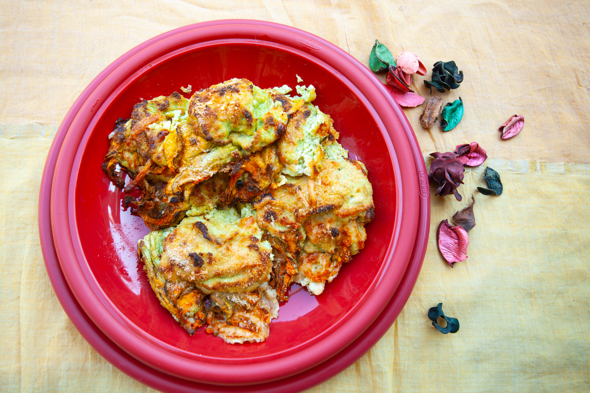 Overhead flat-lay of all ingredients for Tangy Hawaiian Hibiscus Glazed Chicken with Pineapple Relish laid out on a kitchen surface.