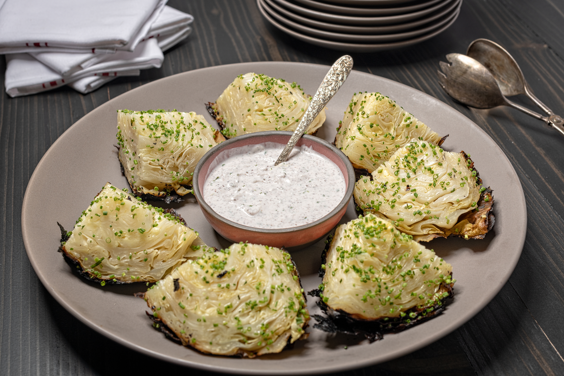 Overhead flat-lay of all ingredients for Tangy Italian Gremolata Artichokes with Parmesan Crust laid out on a kitchen surface.