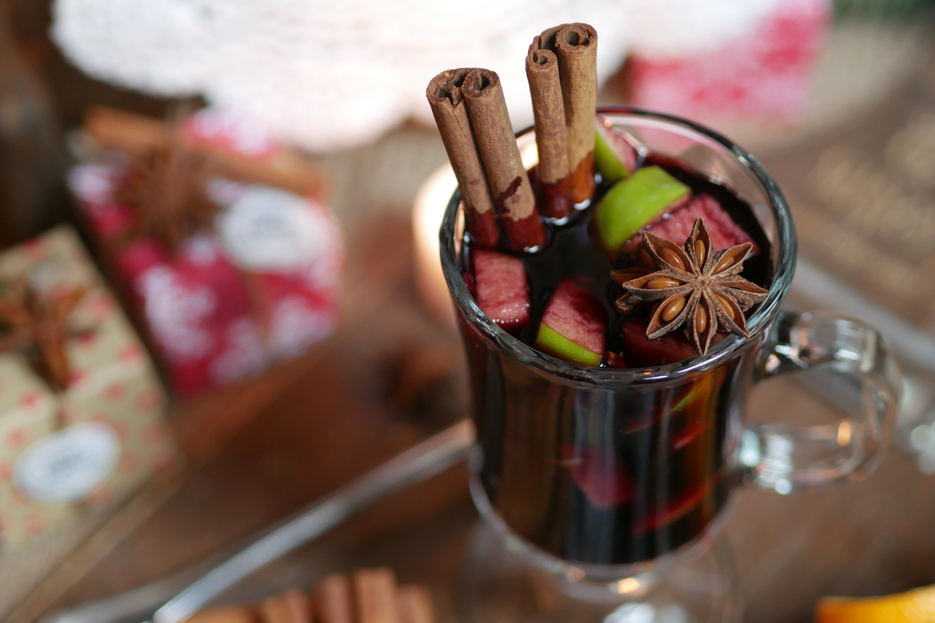 Overhead flat-lay of all ingredients for Tangy Peruvian Chicha Morada with Berries and Cinnamon laid out on a kitchen surface.