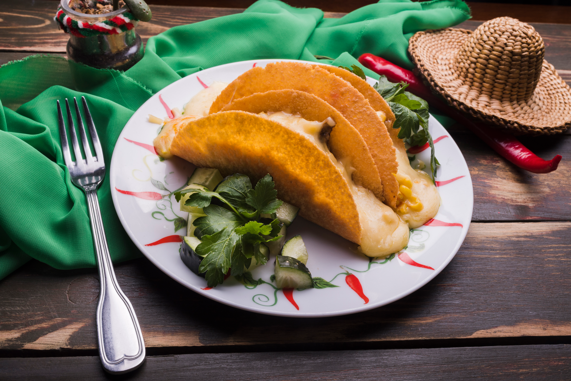 Overhead flat-lay of all ingredients for Tangy Puerto Rican Alcapurrias with Plantain and Beef Filling laid out on a kitchen surface.