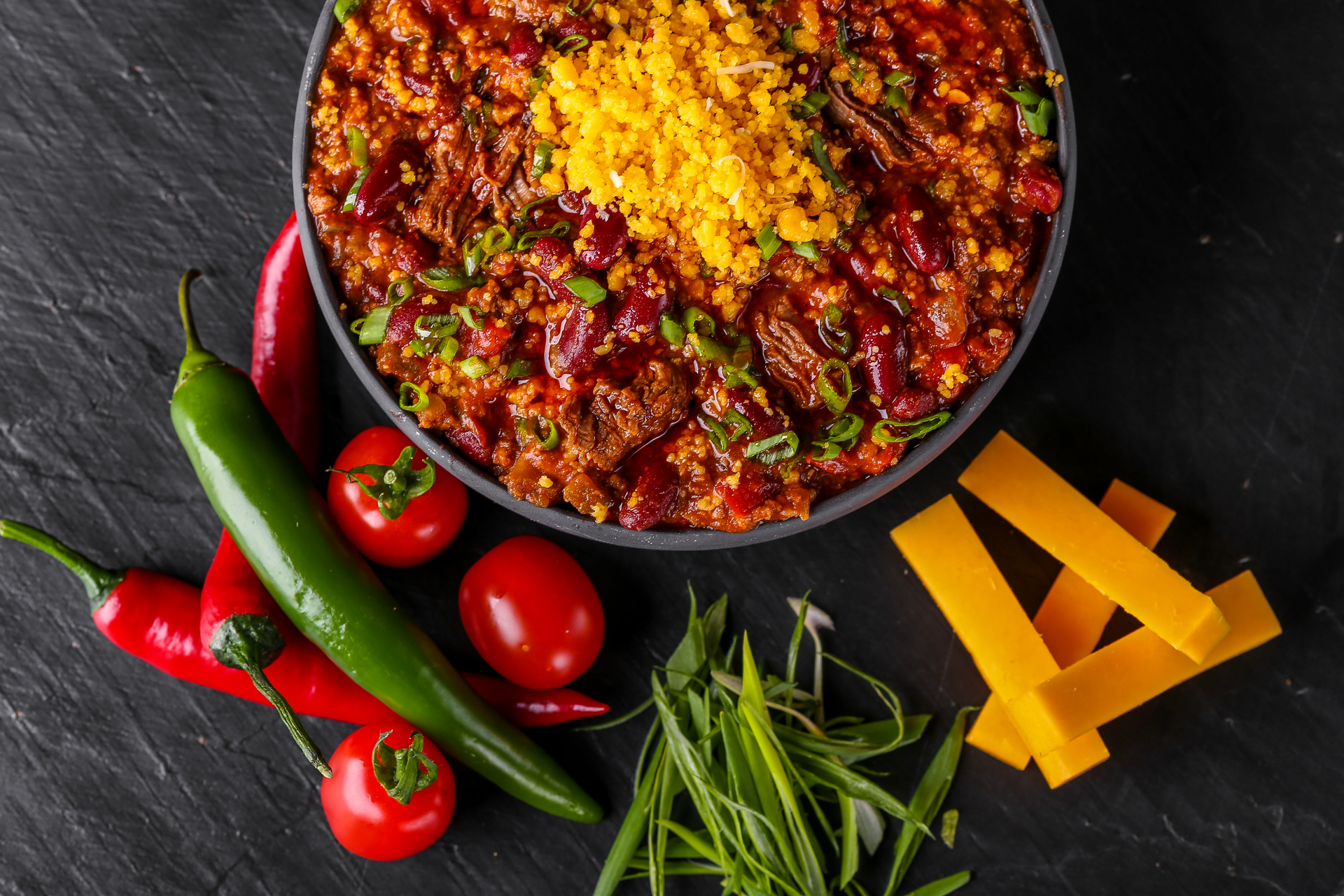 Overhead flat-lay of all ingredients for Tangy Syrian Samkeh Harra with Hot Pepper Sauce laid out on a kitchen surface.