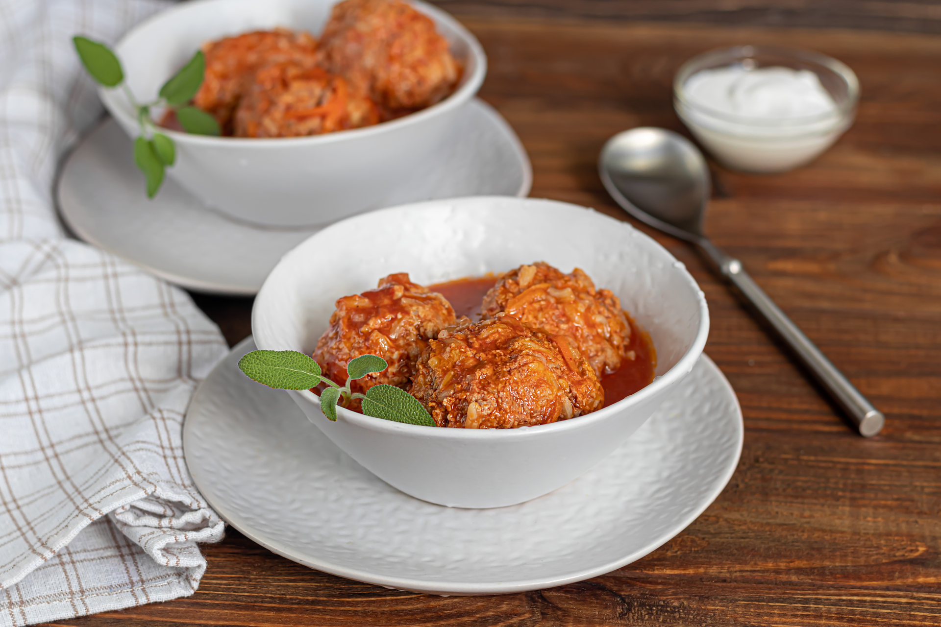 Overhead flat-lay of all ingredients for Tender Polish Golabki with Tomato Sauce laid out on a kitchen surface.