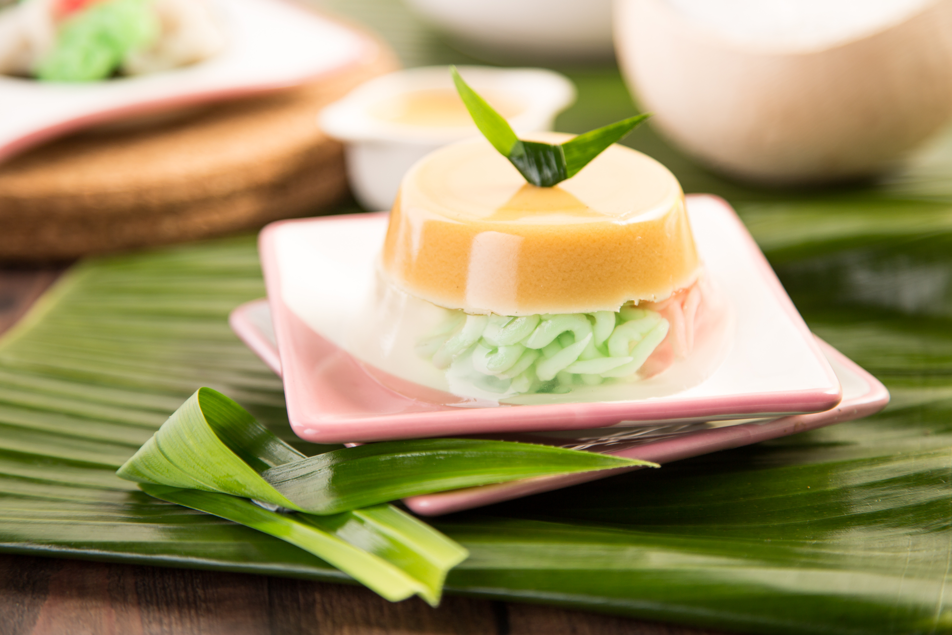 Overhead flat-lay of all ingredients for Thai Coconut Pandan Leaf Cake with Palm Sugar Syrup laid out on a kitchen surface.