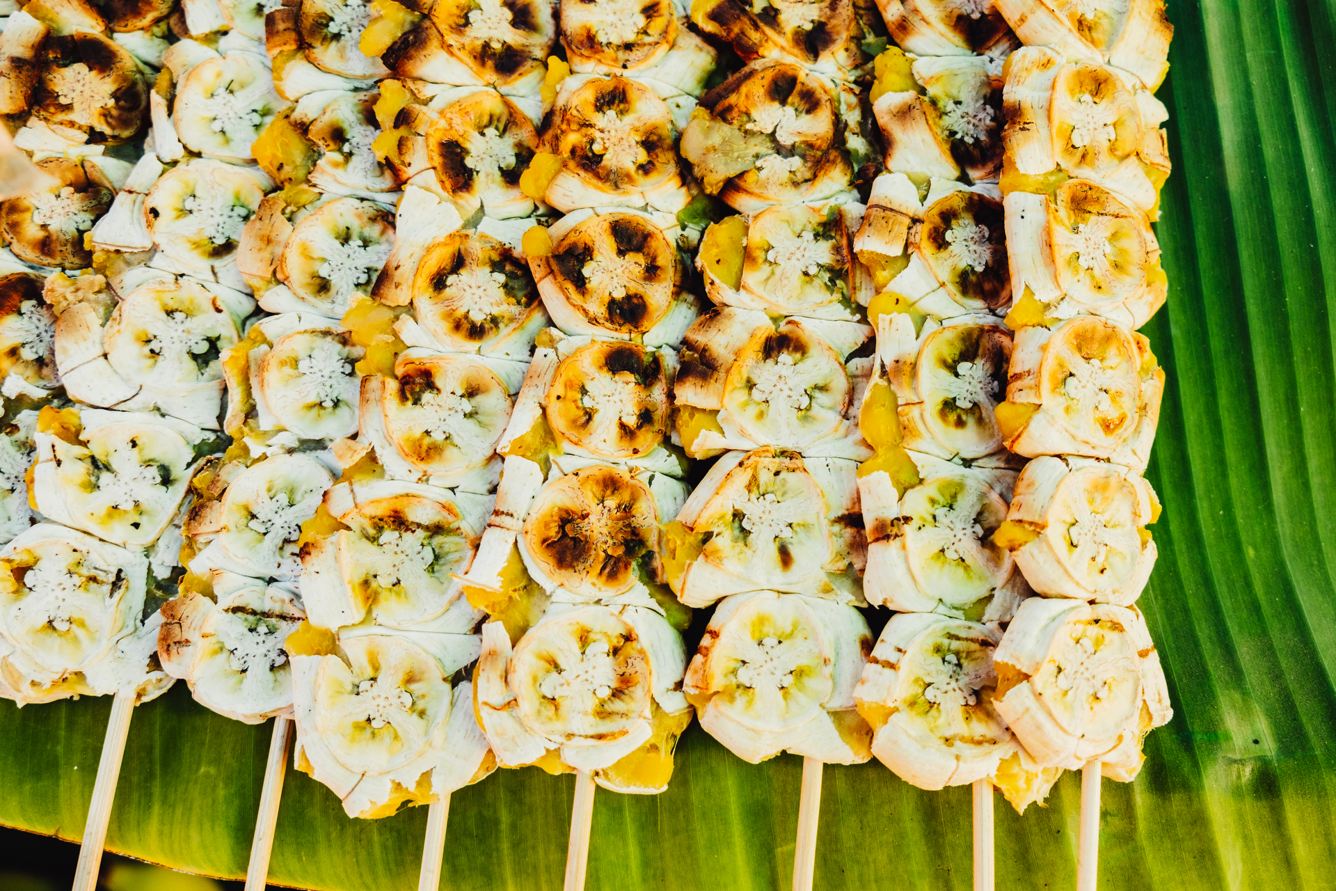 Overhead flat-lay of all ingredients for Thai Culinary Banana Blossom Kebabs with Ginger-Garlic Marinade laid out on a kitchen surface.