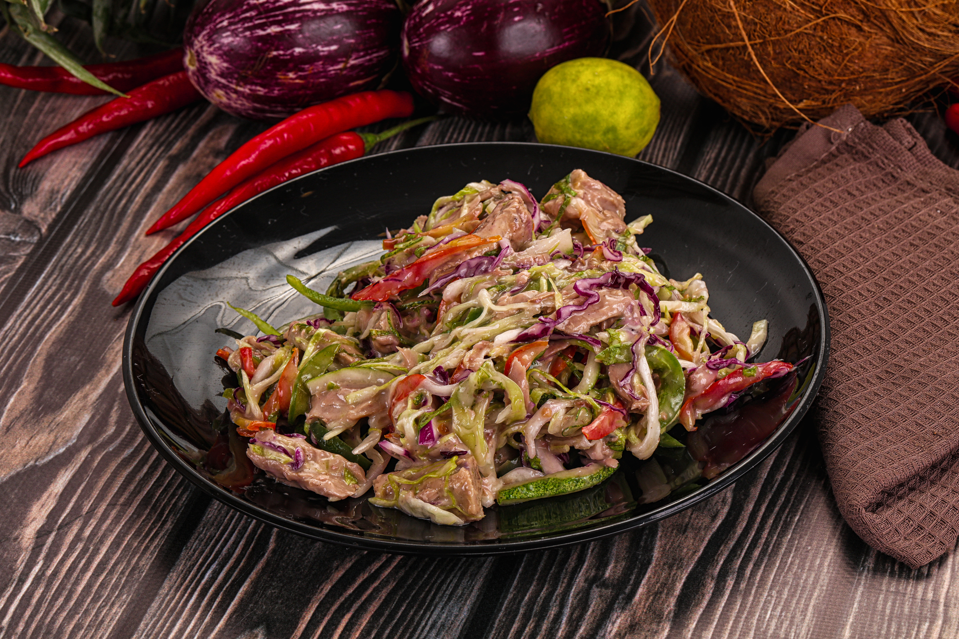 Overhead flat-lay of all ingredients for Thai Lemongrass Beef Salad with Mint and Chili Dressing laid out on a kitchen surface.
