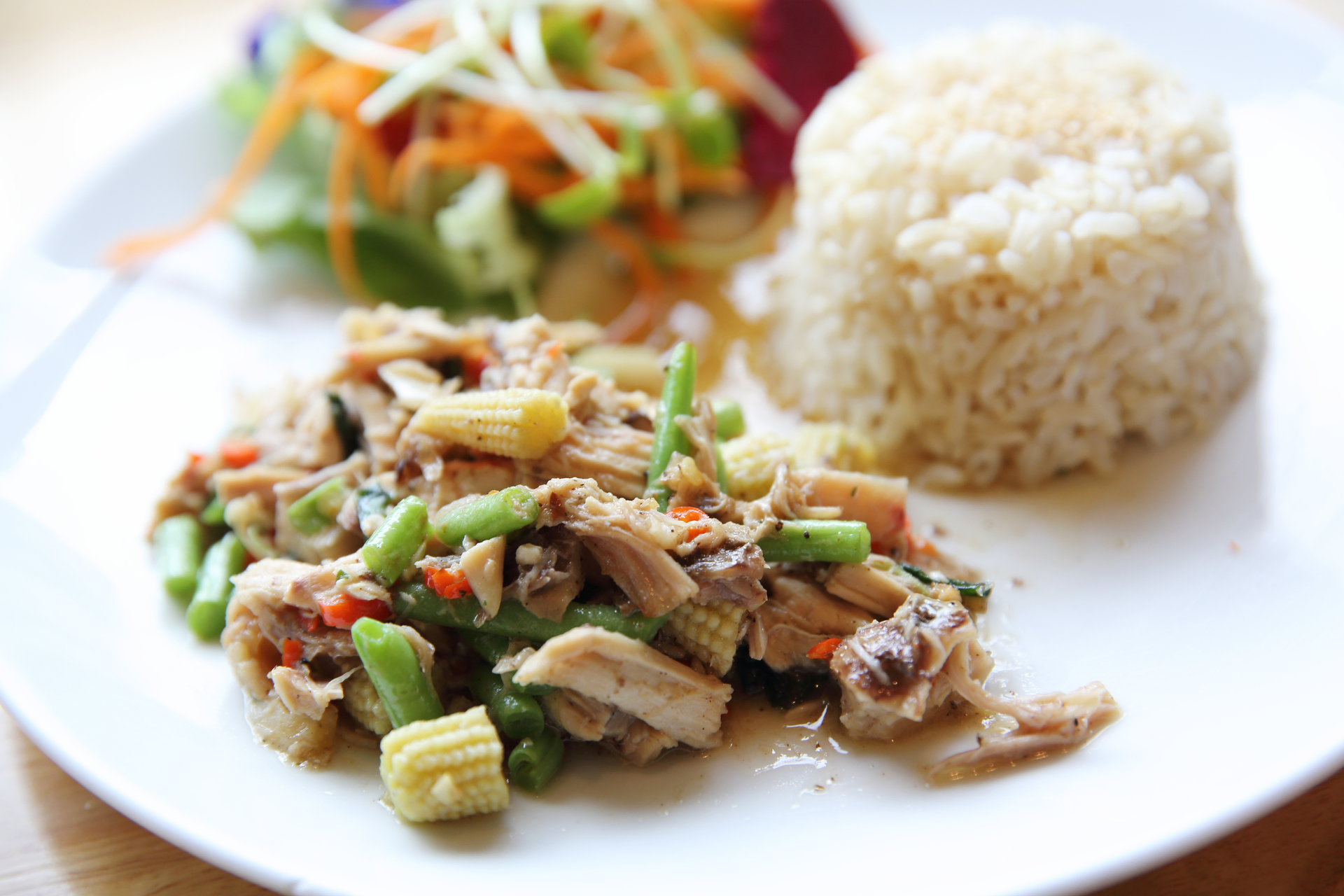 Overhead flat-lay of all ingredients for Thai Lemongrass Pork Stir-Fry with Jasmine Rice laid out on a kitchen surface.