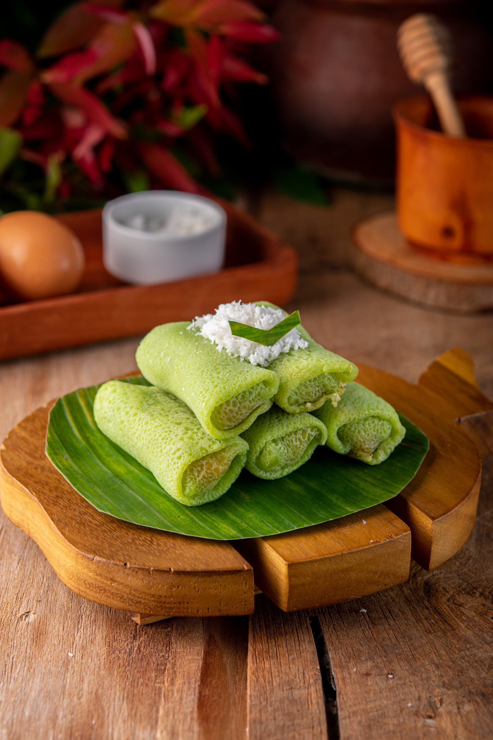 Overhead flat-lay of all ingredients for Thai Pandan Pancakes with Young Coconut Filling laid out on a kitchen surface.