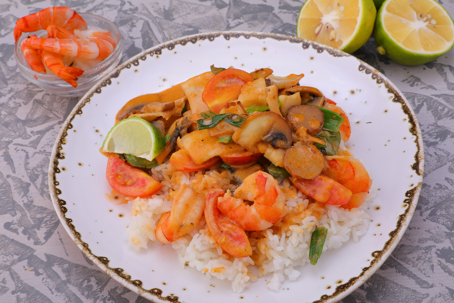 Overhead flat-lay of all ingredients for Thai Spicy Tamarind Shrimp Stir Fry with Jasmine Rice laid out on a kitchen surface.