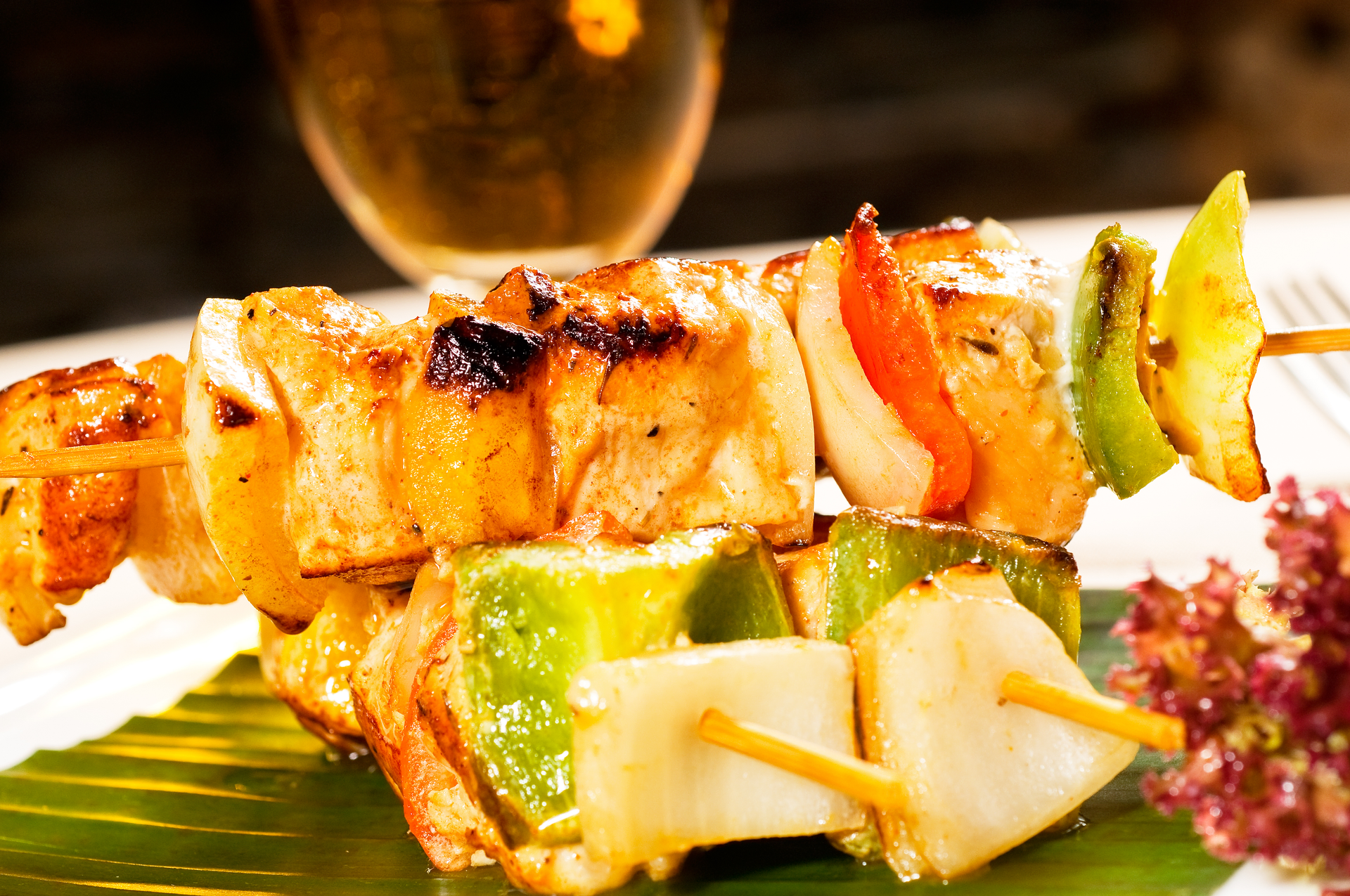 Overhead flat-lay of all ingredients for Thai Tamarind Chicken Skewers with Pineapple Glaze laid out on a kitchen surface.