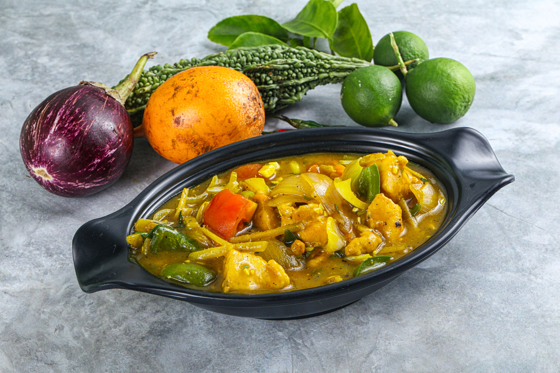 Overhead flat-lay of all ingredients for Thai Turmeric Coconut Curry with Pumpkin and Sweet Basil laid out on a kitchen surface.