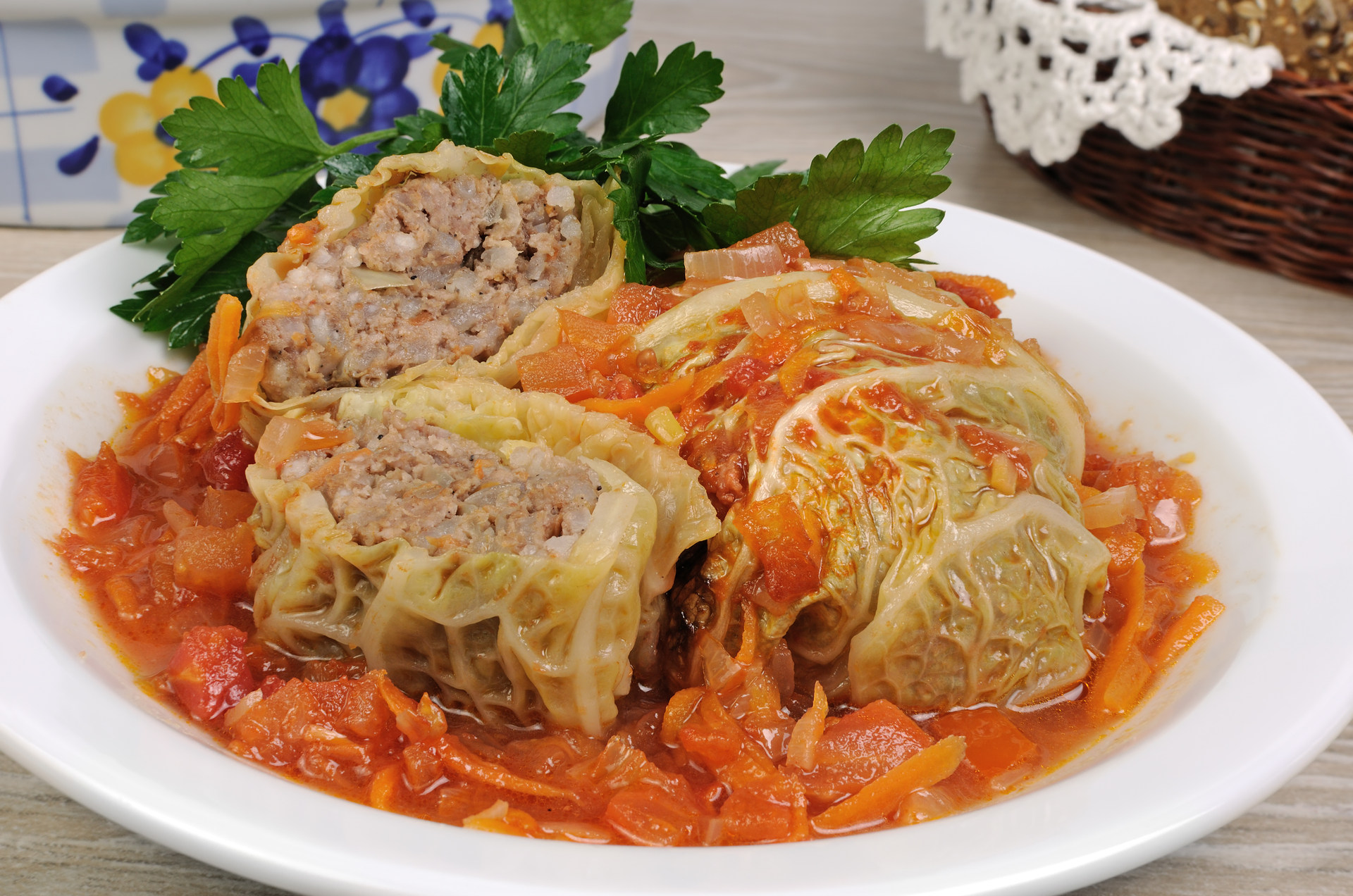 Overhead flat-lay of all ingredients for Traditional Andorran Escudella de Pages with Meatballs and Cabbage laid out on a kitchen surface.