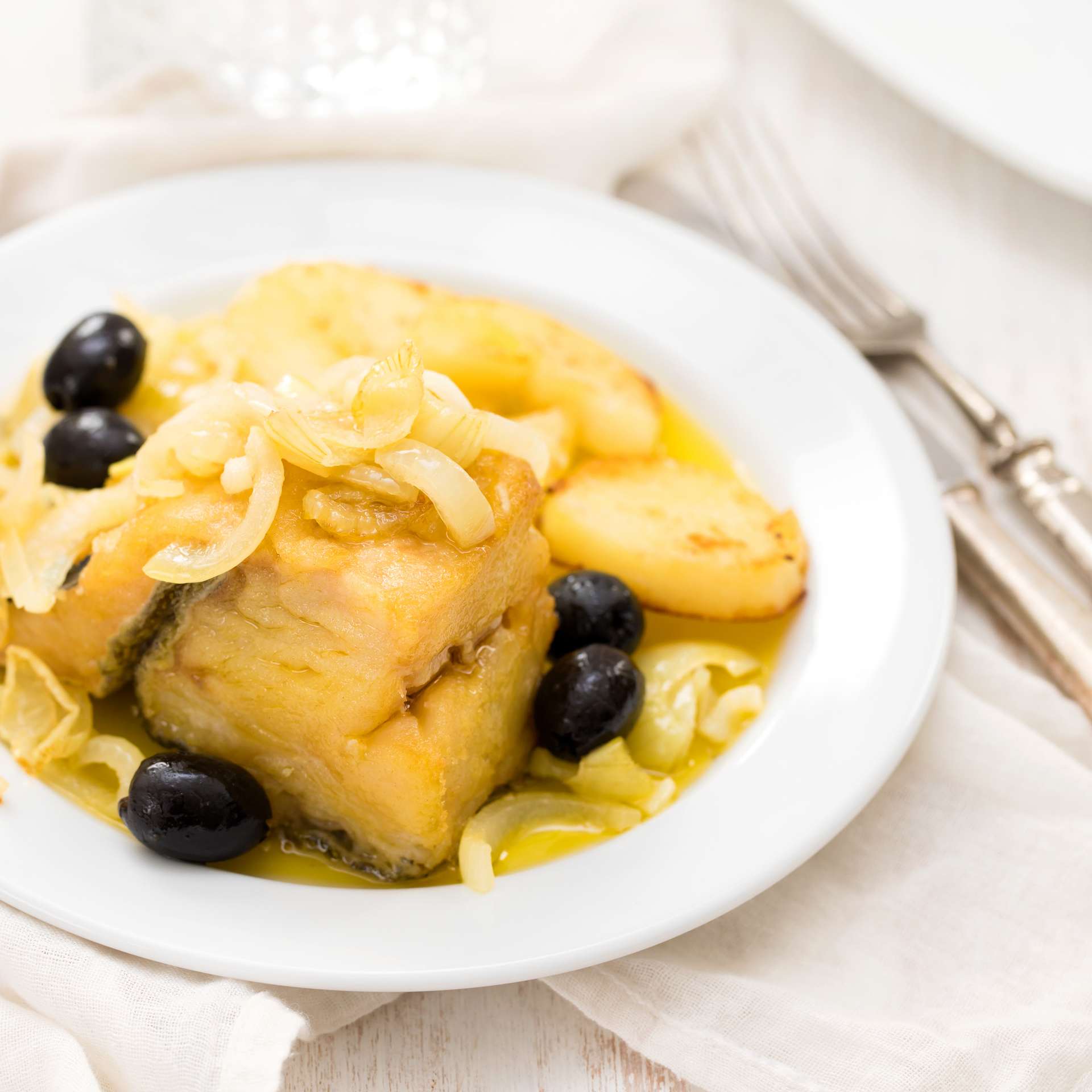 Traditional Basque Bacalao al Pil Pil — Main Course served and photographed from above
