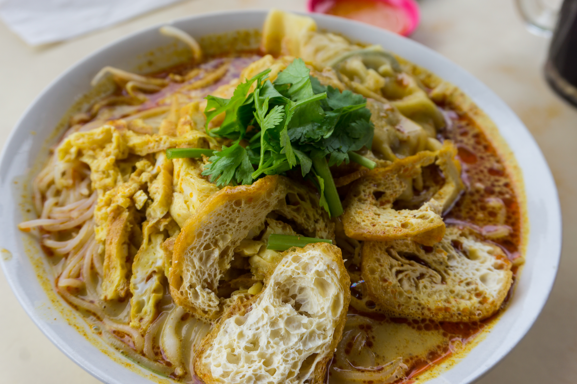 Traditional Indonesian Bubur Ayam with Shredded Chicken Satay — Breakfast served and photographed from above