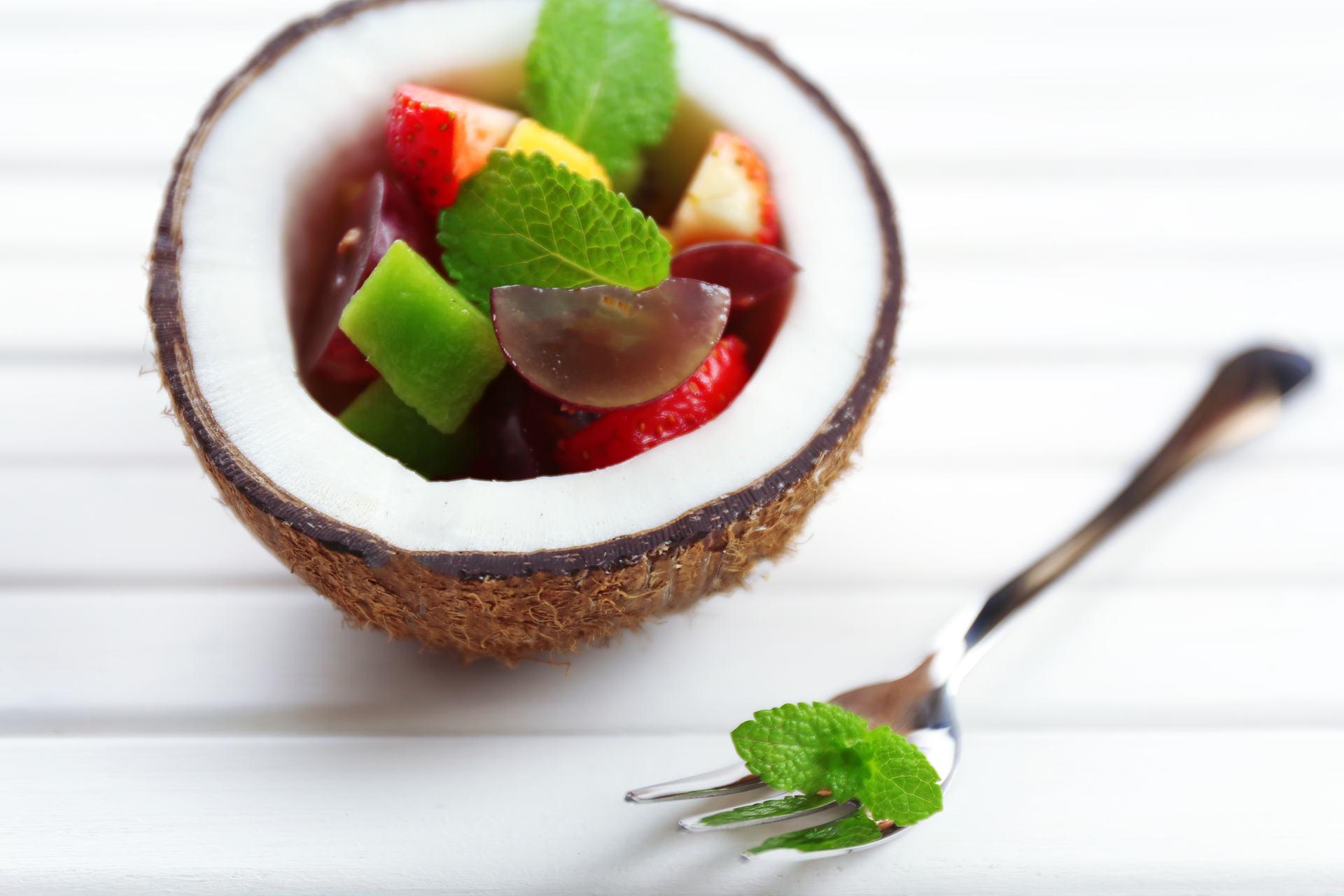 Overhead flat-lay of all ingredients for Tropical Fijian Kokoda with Coconut Cream and Lime laid out on a kitchen surface.