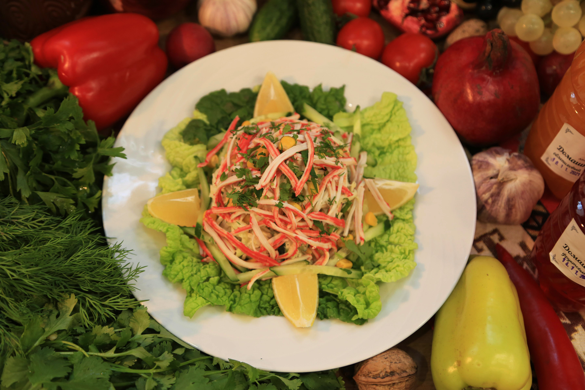 Overhead flat-lay of all ingredients for Tropical Vietnamese Papaya Salad with Lime Zest and Fresh Mint laid out on a kitchen surface.