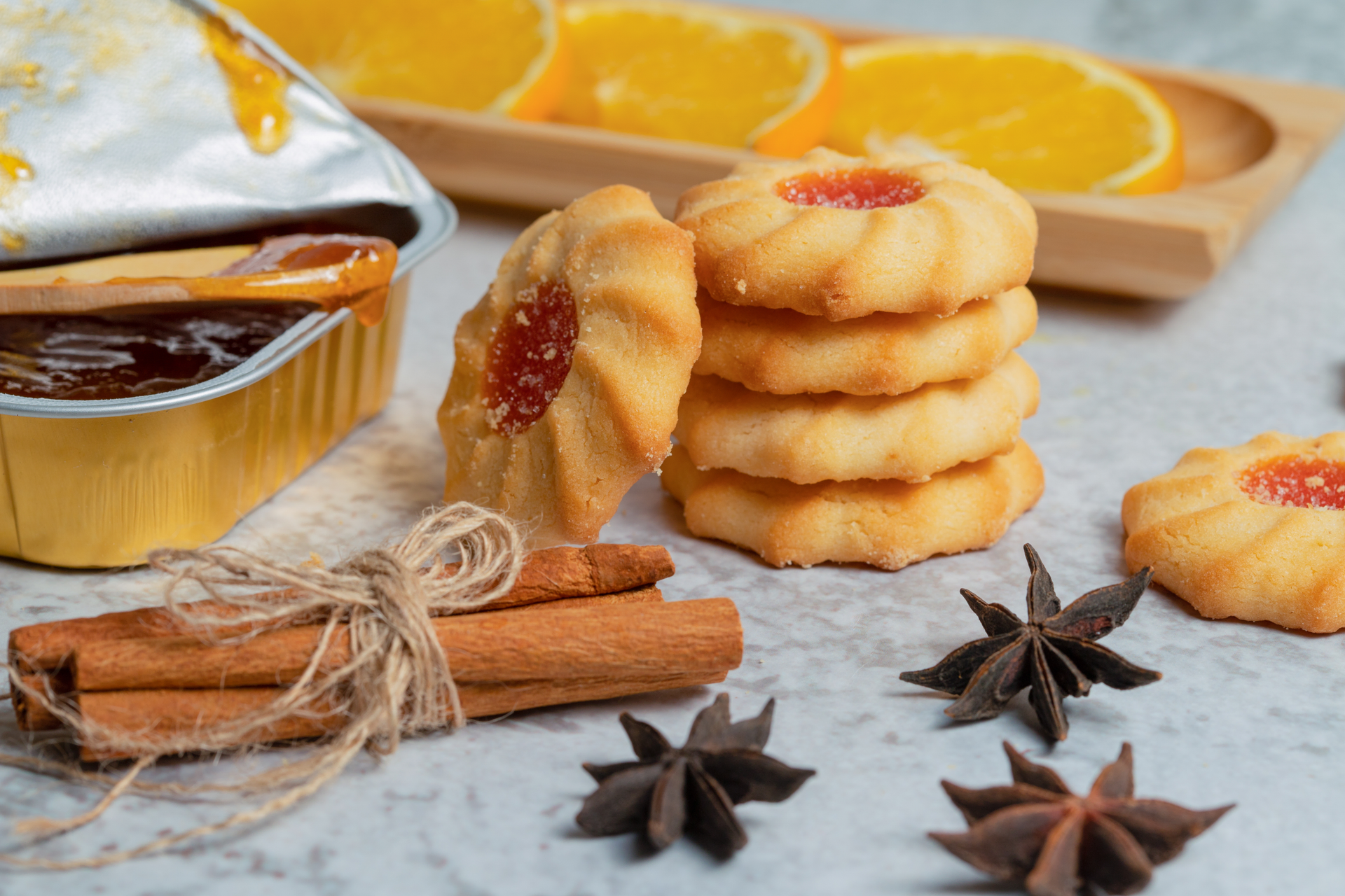 Overhead flat-lay of all ingredients for Tunisian Turmeric and Anise Biscuits with Honey Glaze laid out on a kitchen surface.