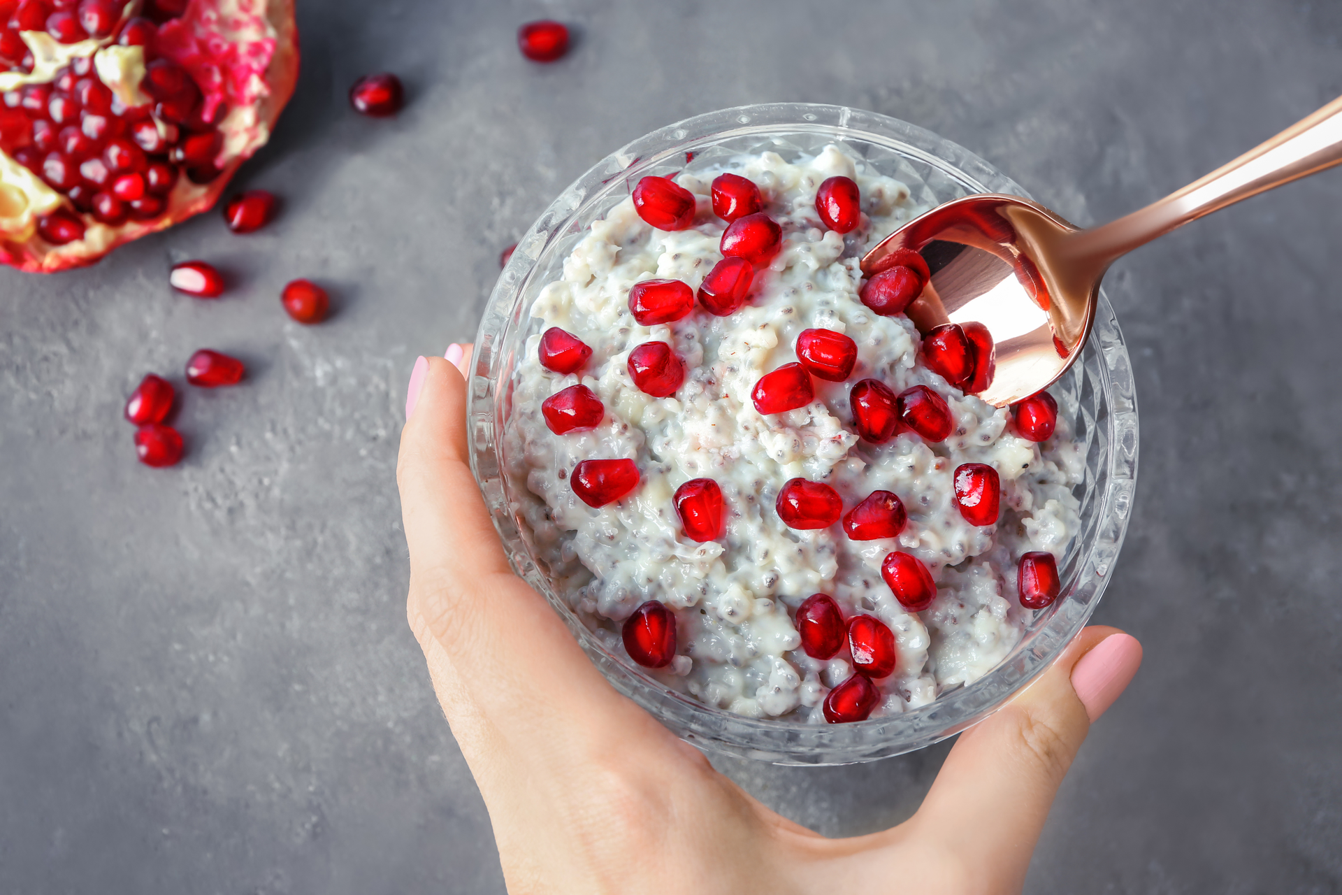 Overhead flat-lay of all ingredients for Turkish Ashure with Pomegranate and Nuts laid out on a kitchen surface.