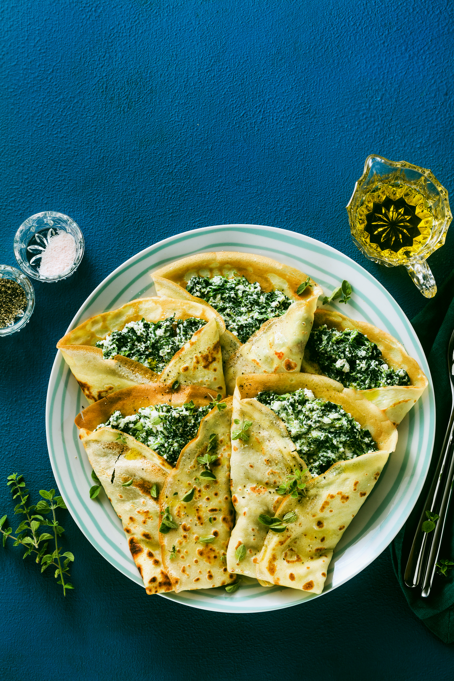 Overhead flat-lay of all ingredients for Turkish Gözleme with Spinach and Feta laid out on a kitchen surface.