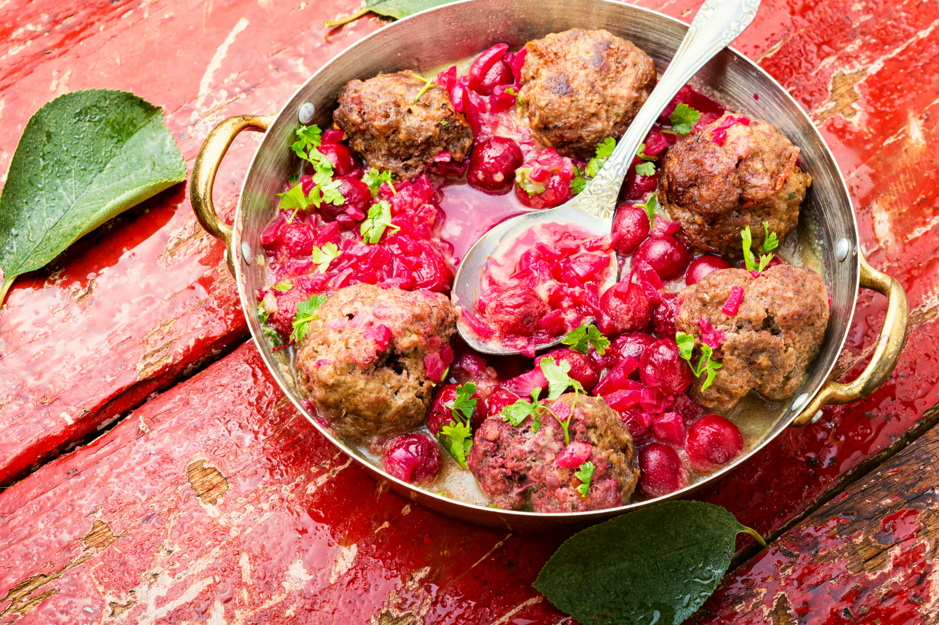 Overhead flat-lay of all ingredients for Turkish İnegöl Köfte with Sumac Onions and Pomegranate laid out on a kitchen surface.