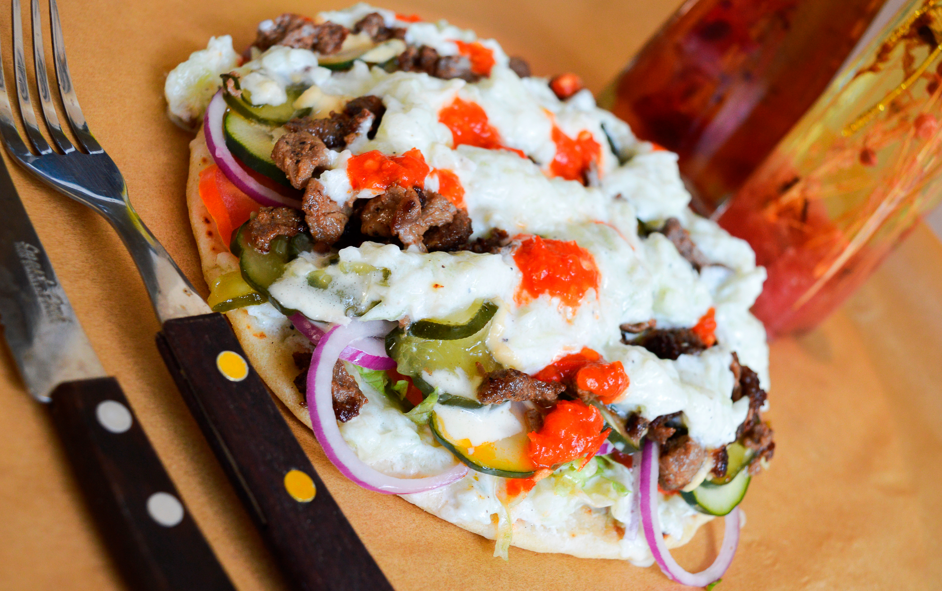 Turkish Kebab Wraps with Sumac Onions and Yogurt Sauce — Main Course served and photographed from above