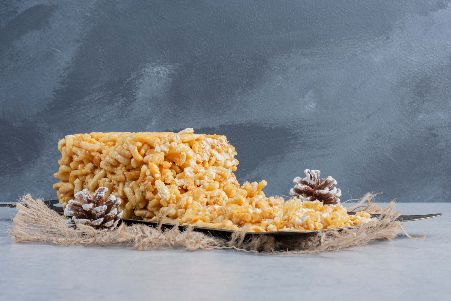 Overhead flat-lay of all ingredients for Turkish Semolina Helva with Pine Nuts and Honey laid out on a kitchen surface.