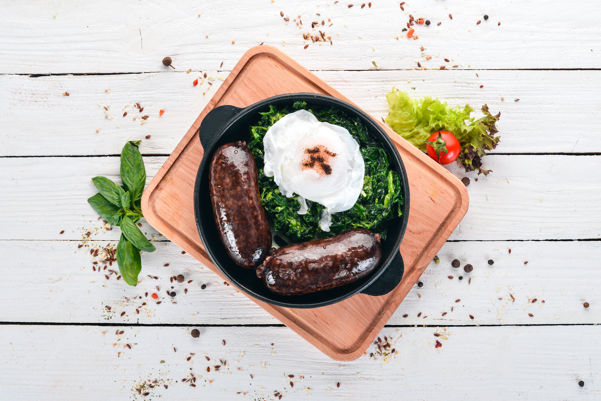 Overhead flat-lay of all ingredients for Turkish Sumac-Dusted Grilled Kofte with Cucumber Yogurt laid out on a kitchen surface.