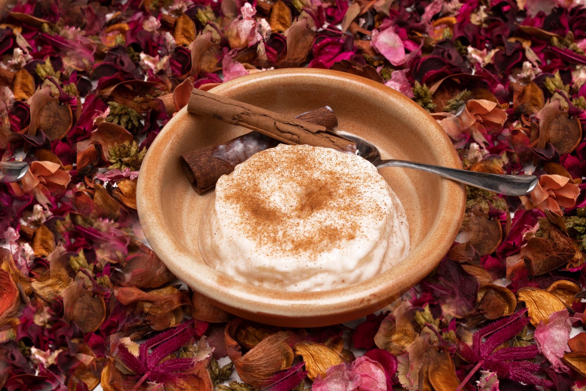 Overhead flat-lay of all ingredients for Turkish Sütlaç with Rose Water and Cinnamon laid out on a kitchen surface.