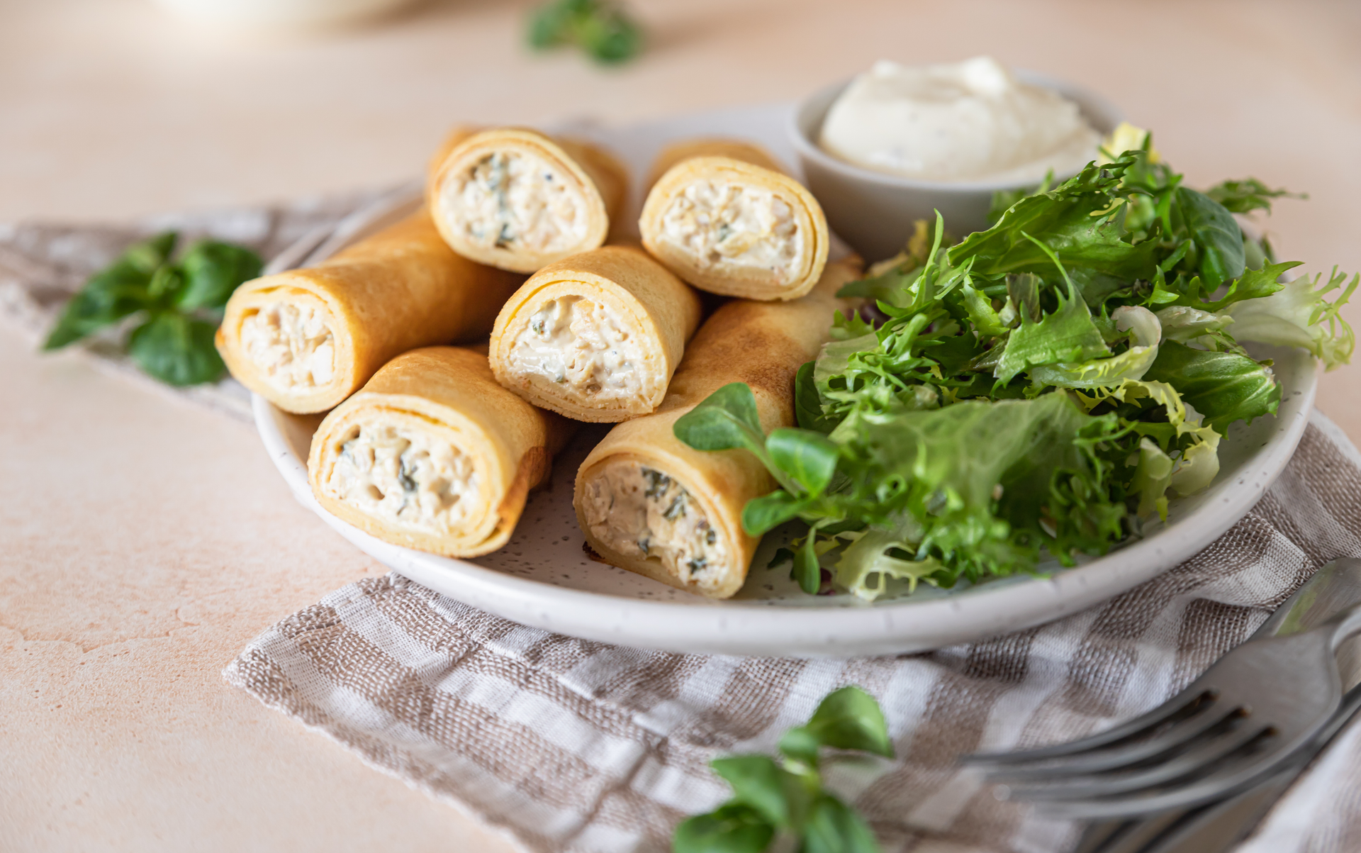 Overhead flat-lay of all ingredients for Ukrainian Salo-Wrapped Spring Onion Rolls with Horseradish Cream laid out on a kitchen surface.
