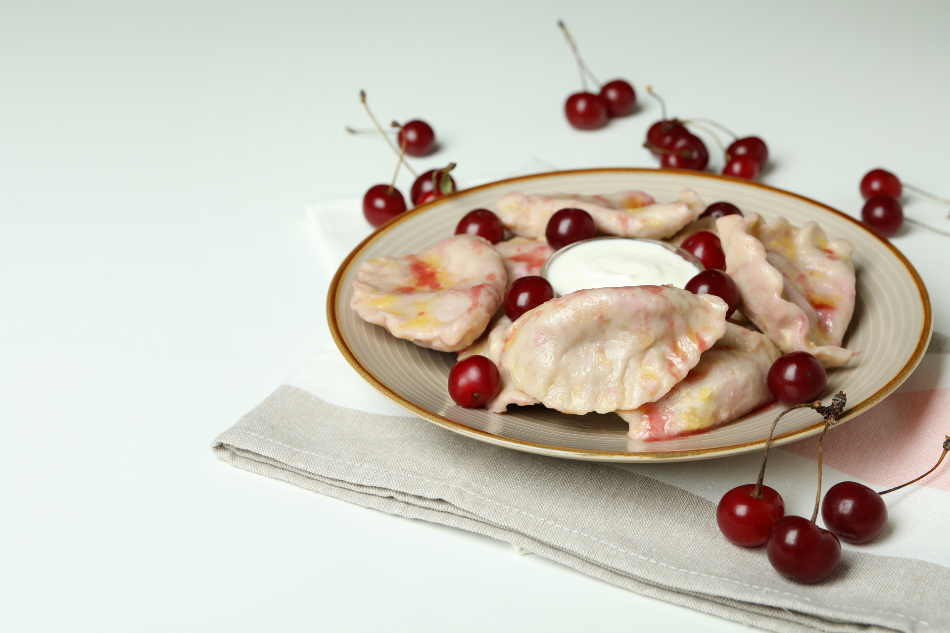 Ukrainian Vareniki with Sweet Cherry Filling — Dessert served and photographed from above