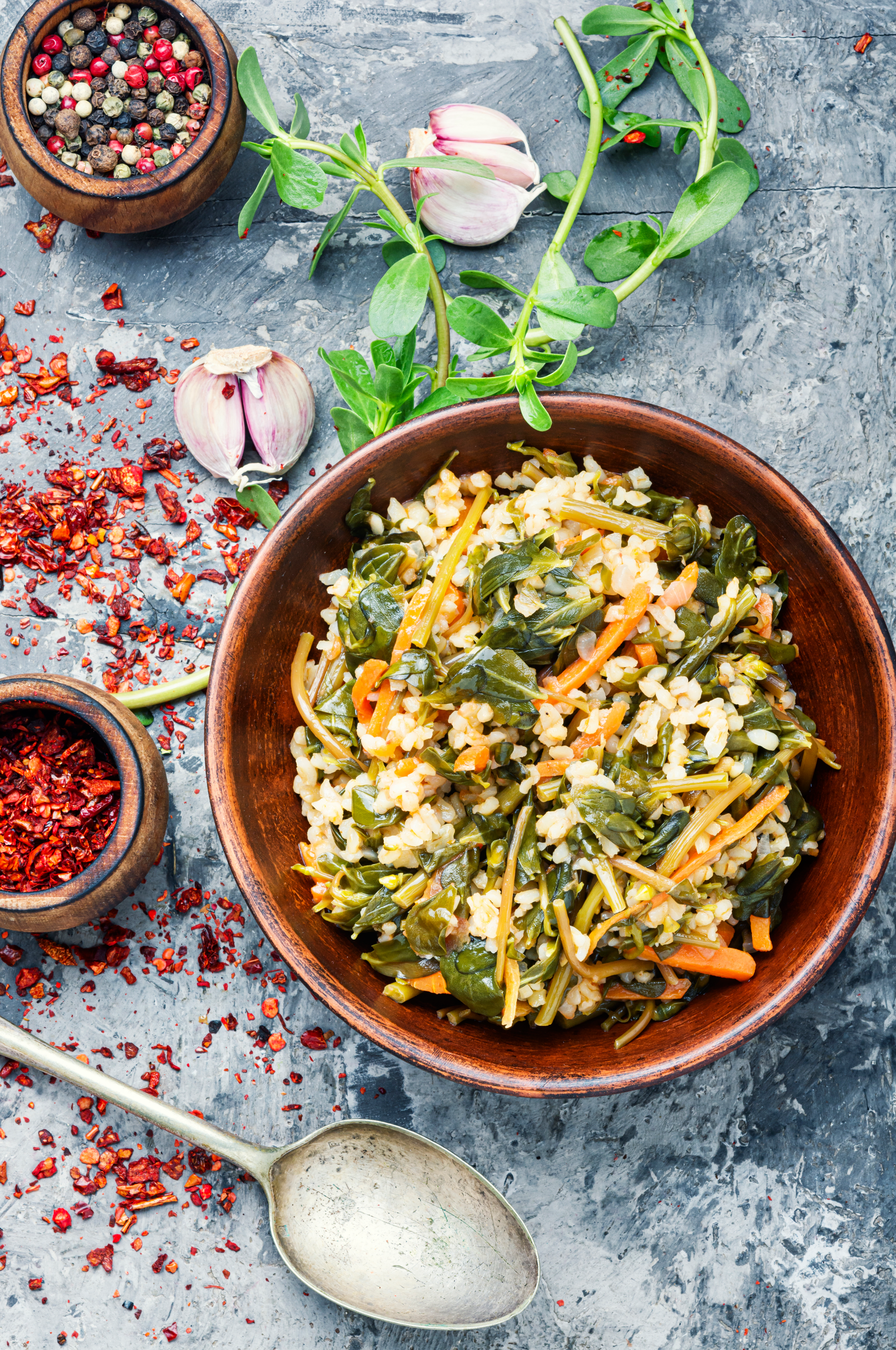 Overhead flat-lay of all ingredients for Uzbek Mastava with Rice and Fresh Herbs laid out on a kitchen surface.