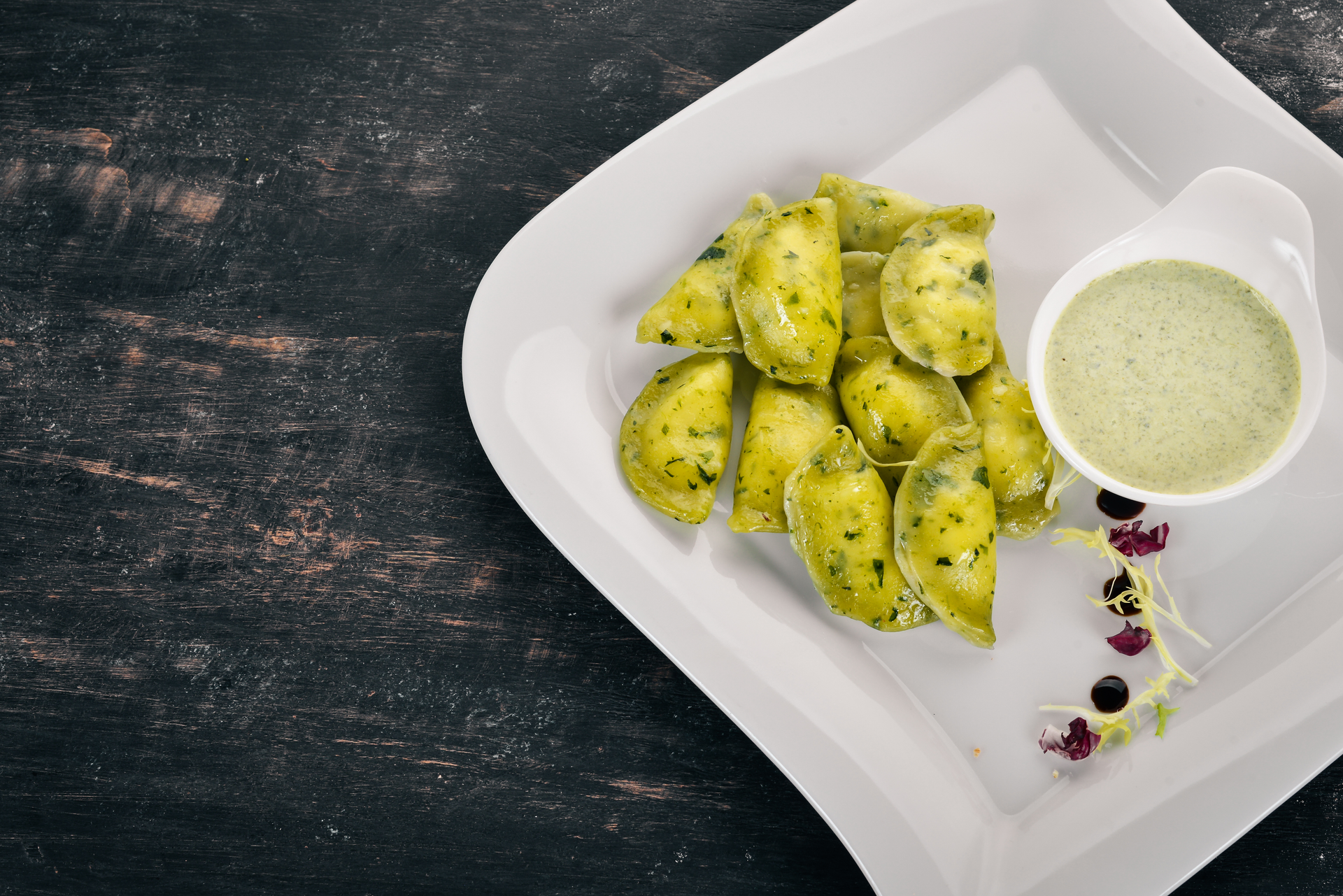 Overhead flat-lay of all ingredients for Velvet Jamaican Rundown with Green Banana Dumplings laid out on a kitchen surface.